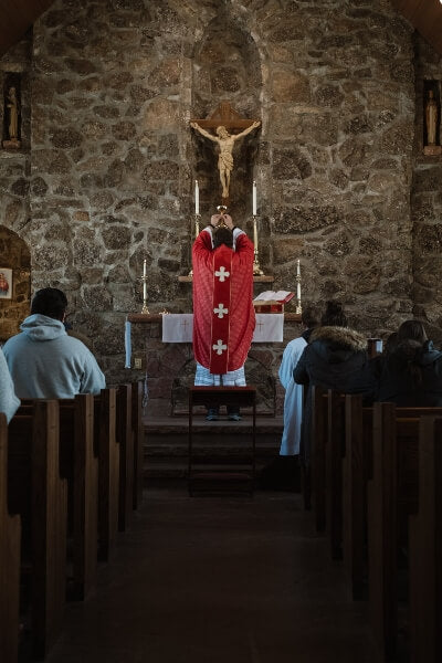 Why does the priest face the altar in the Latin Mass?
