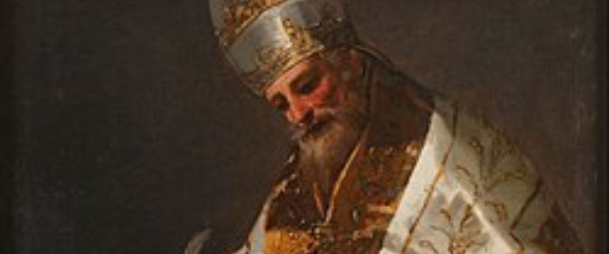 Religious bishop in ornate robes writing in a large book at a desk