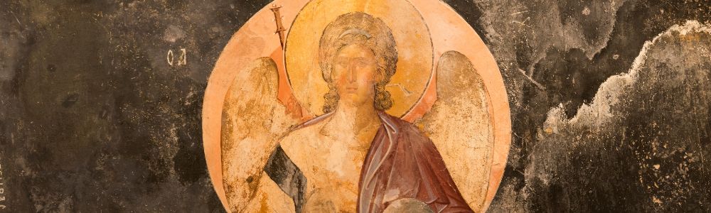 Ancient religious fresco depicting an angel with wings and a halo.