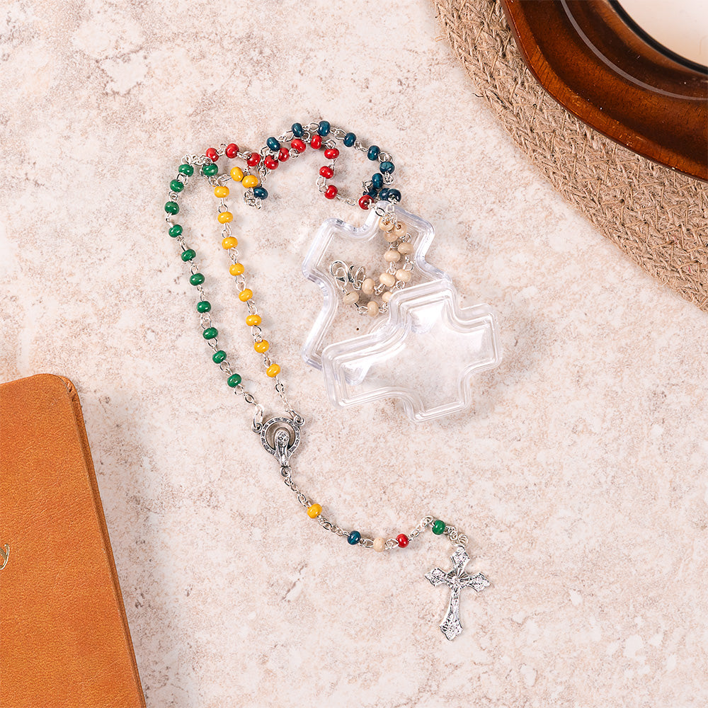 Colorful World Mission rosary with silver cross on a textured surface