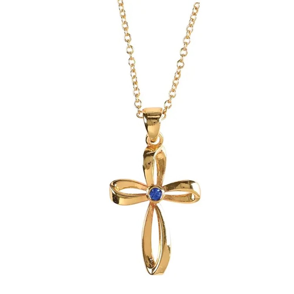 Gold-tone cross necklace with a blue stone accent, ribbon-like design, and delicate chain for elegant style.