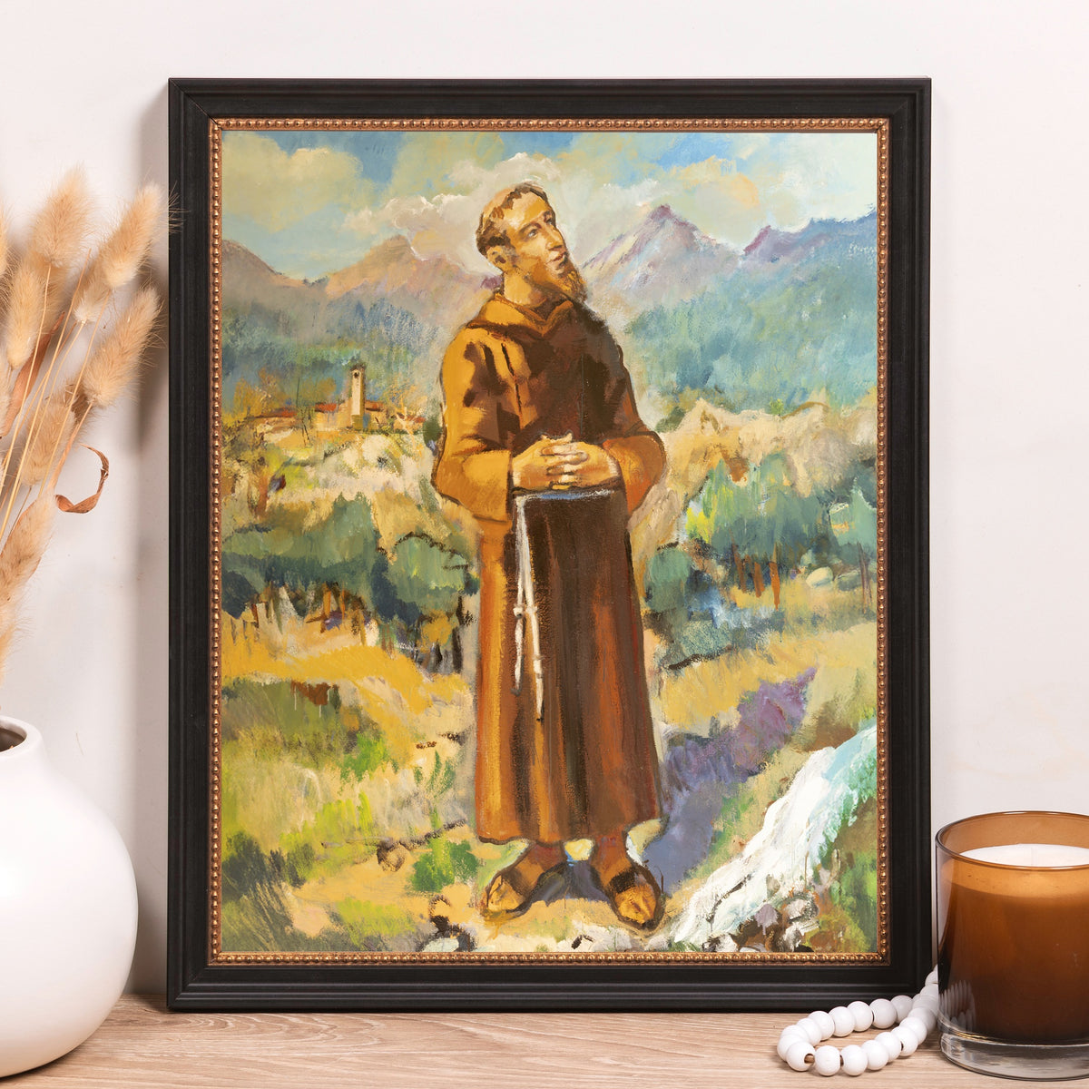 Framed canvas art: A brown-robed friar in landscape, oil painting style.