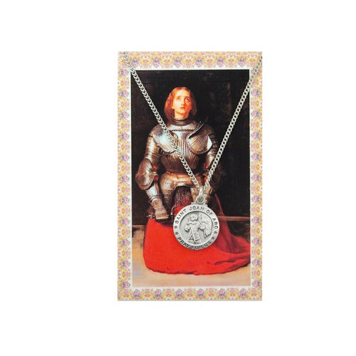Saint Joan of Arc necklace. Silver metal pendant and chain on a floral card featuring Joan in armor.