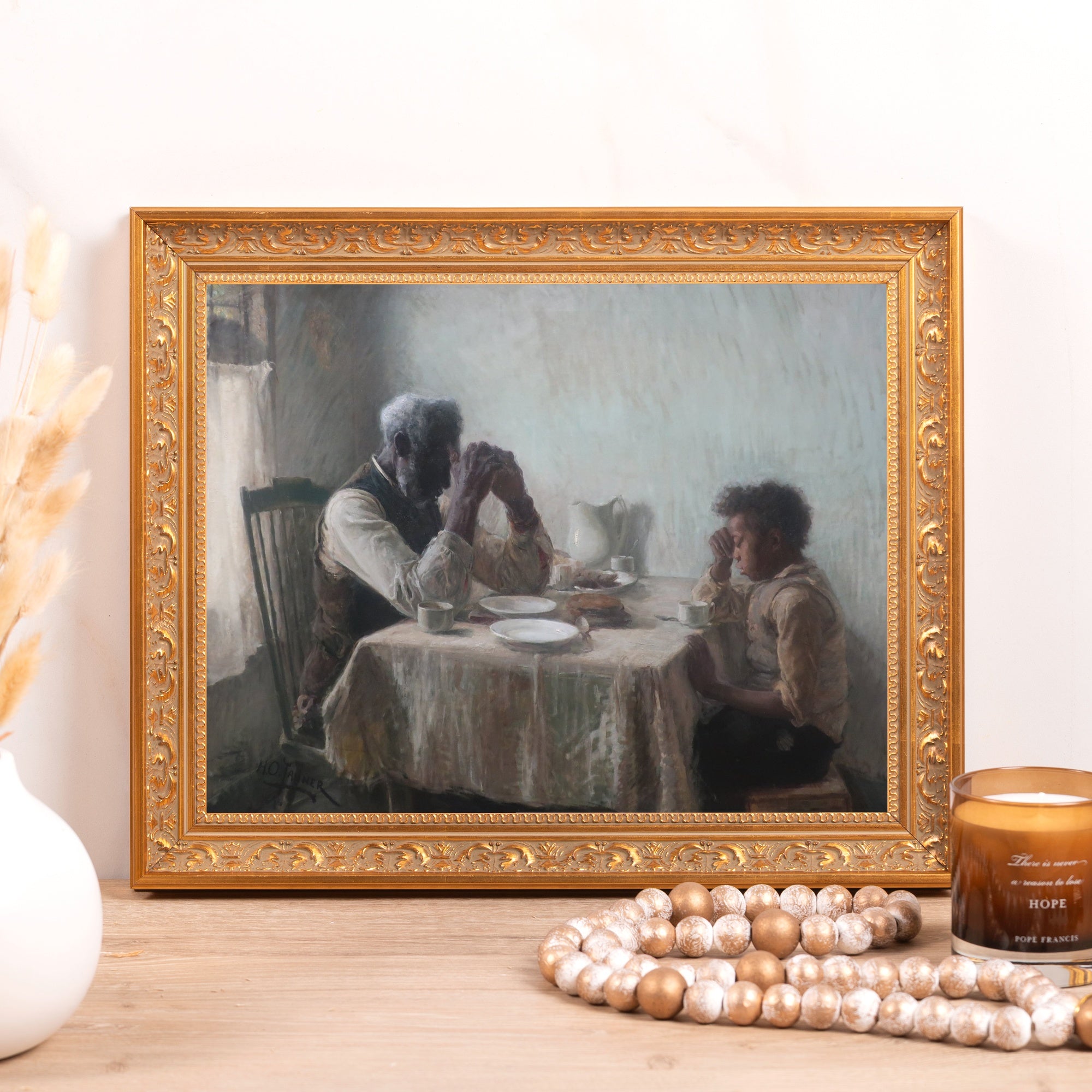 Framed Print of Tanner's "The Thankful Poor" in a detailed ornate gold frame.