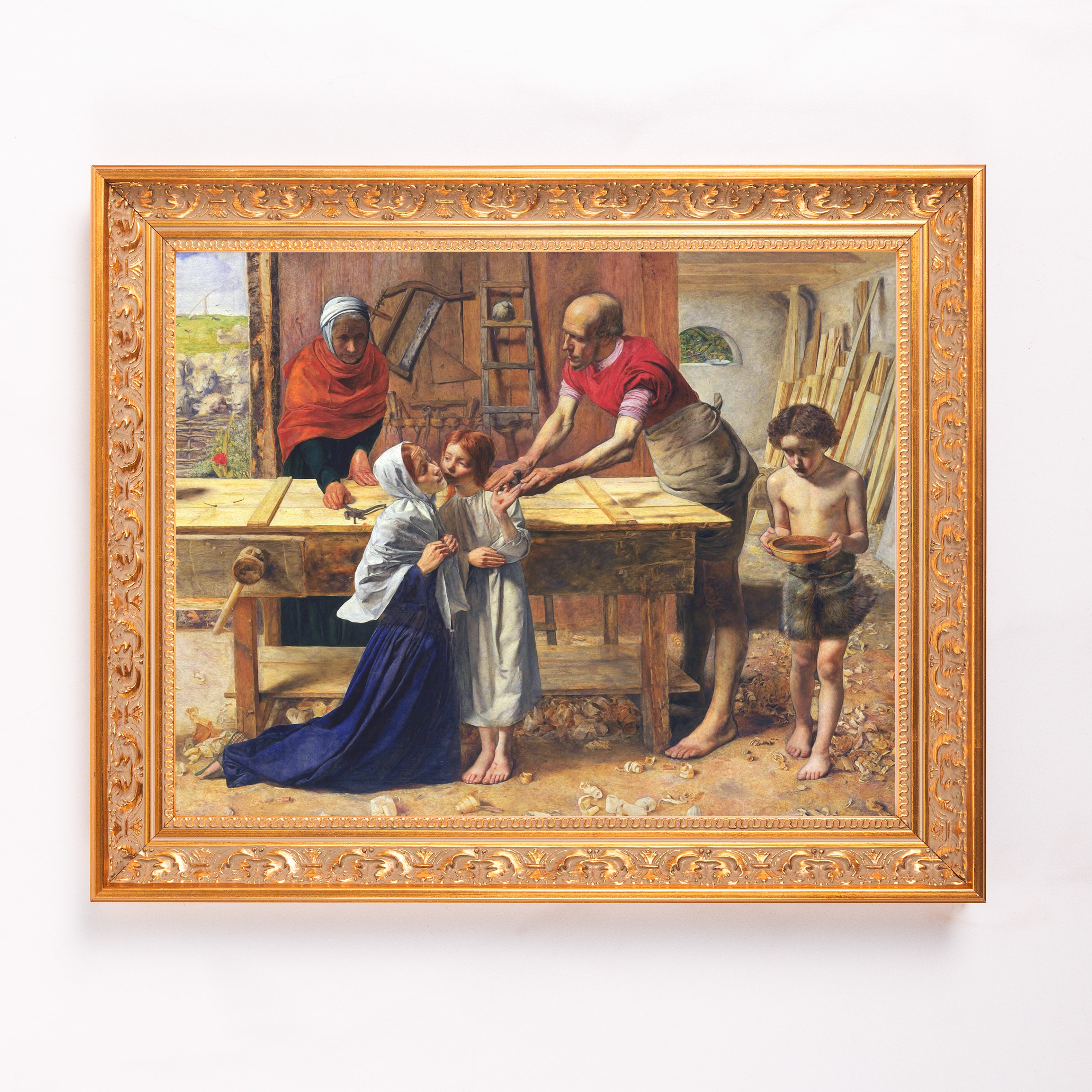 Framed Artwork portrays Jesus working in the carpentry of his father, Joseph, in a gilt frame.