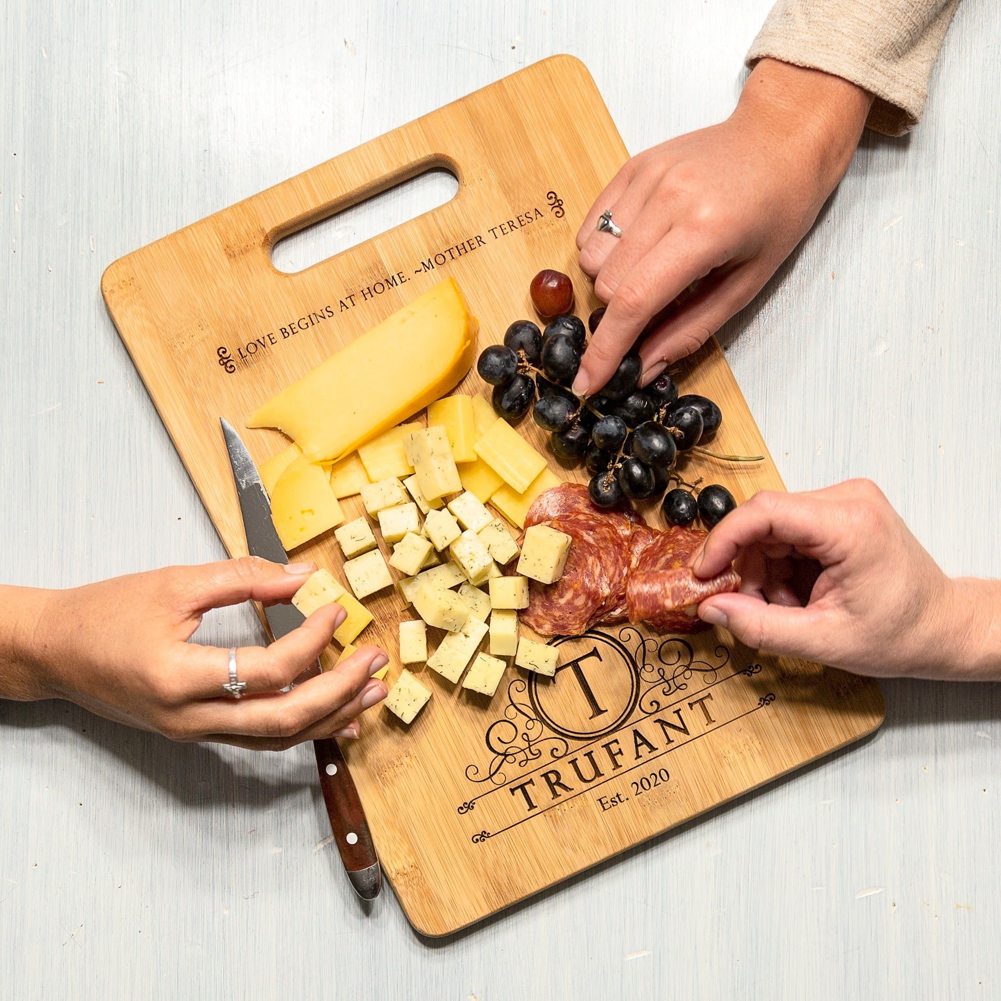 Love Begins at Home Cutting Board