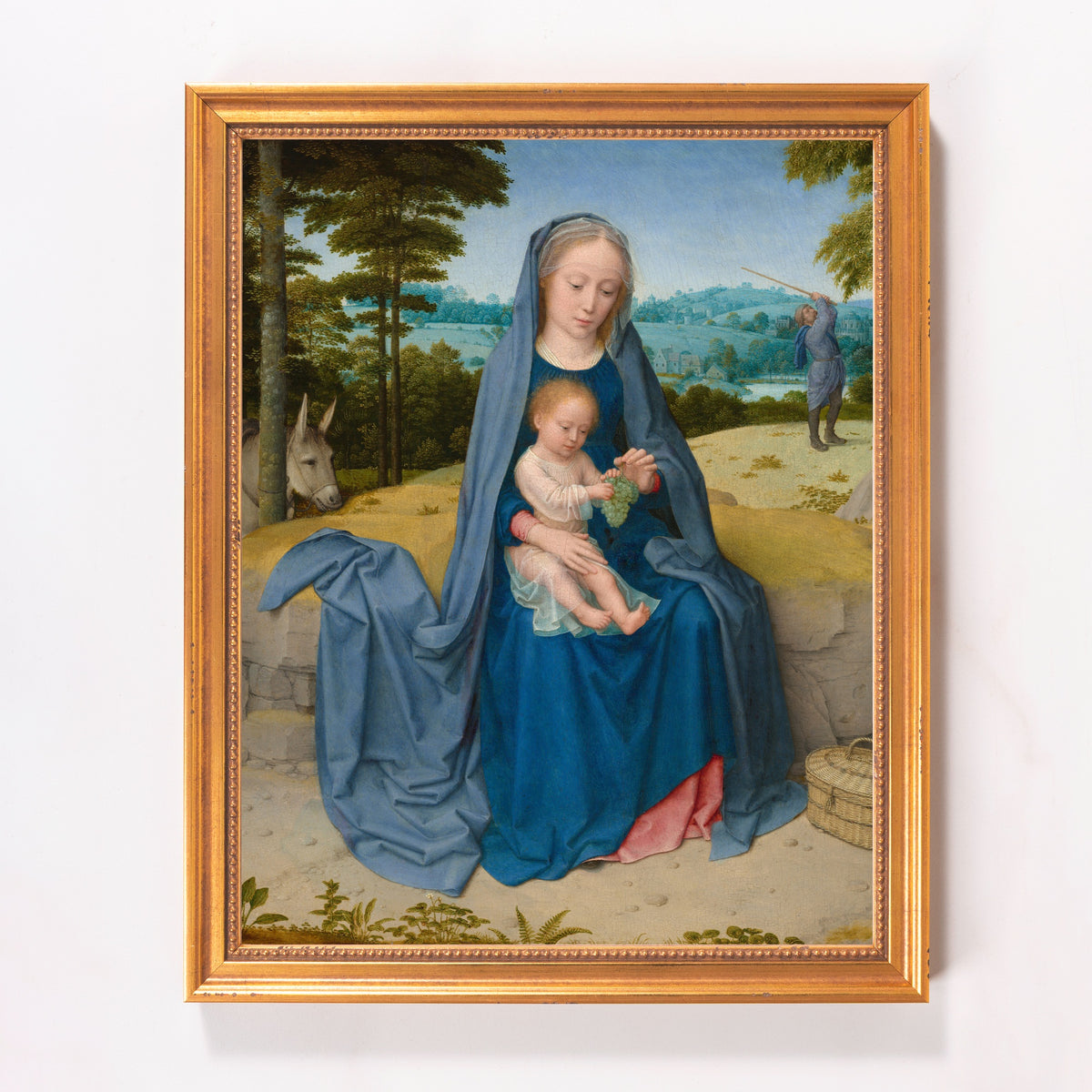 Framed art print of Madonna and child in landscape, blues and golds.