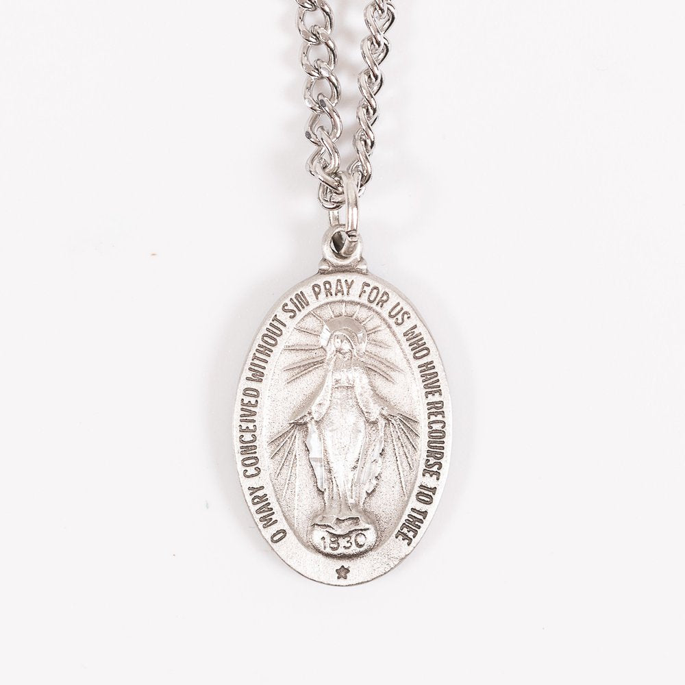 Silver, religious Miraculous Medal pendant necklace with engraved text and image.