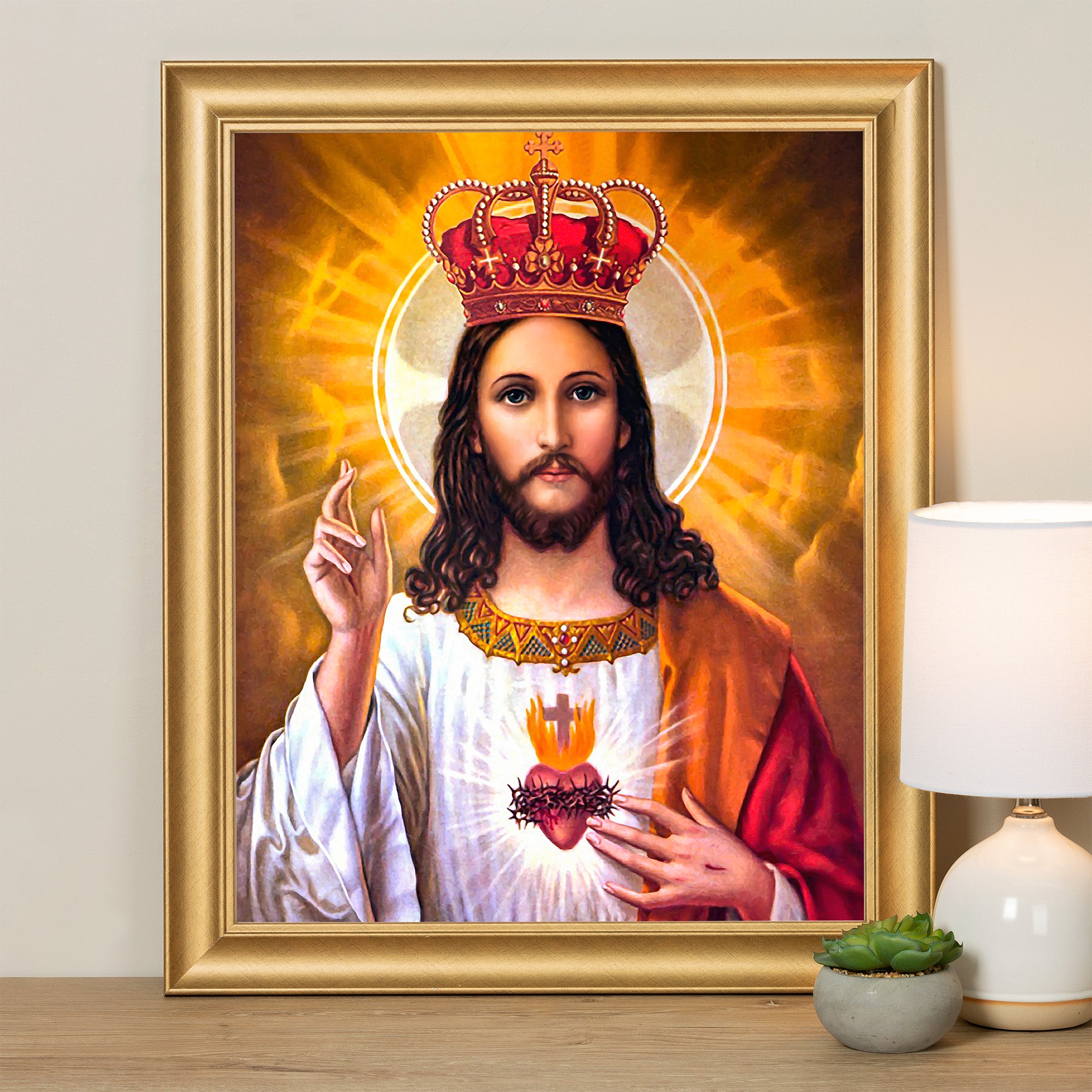 Framed painting of Jesus wearing a crown, with a gold frame.
