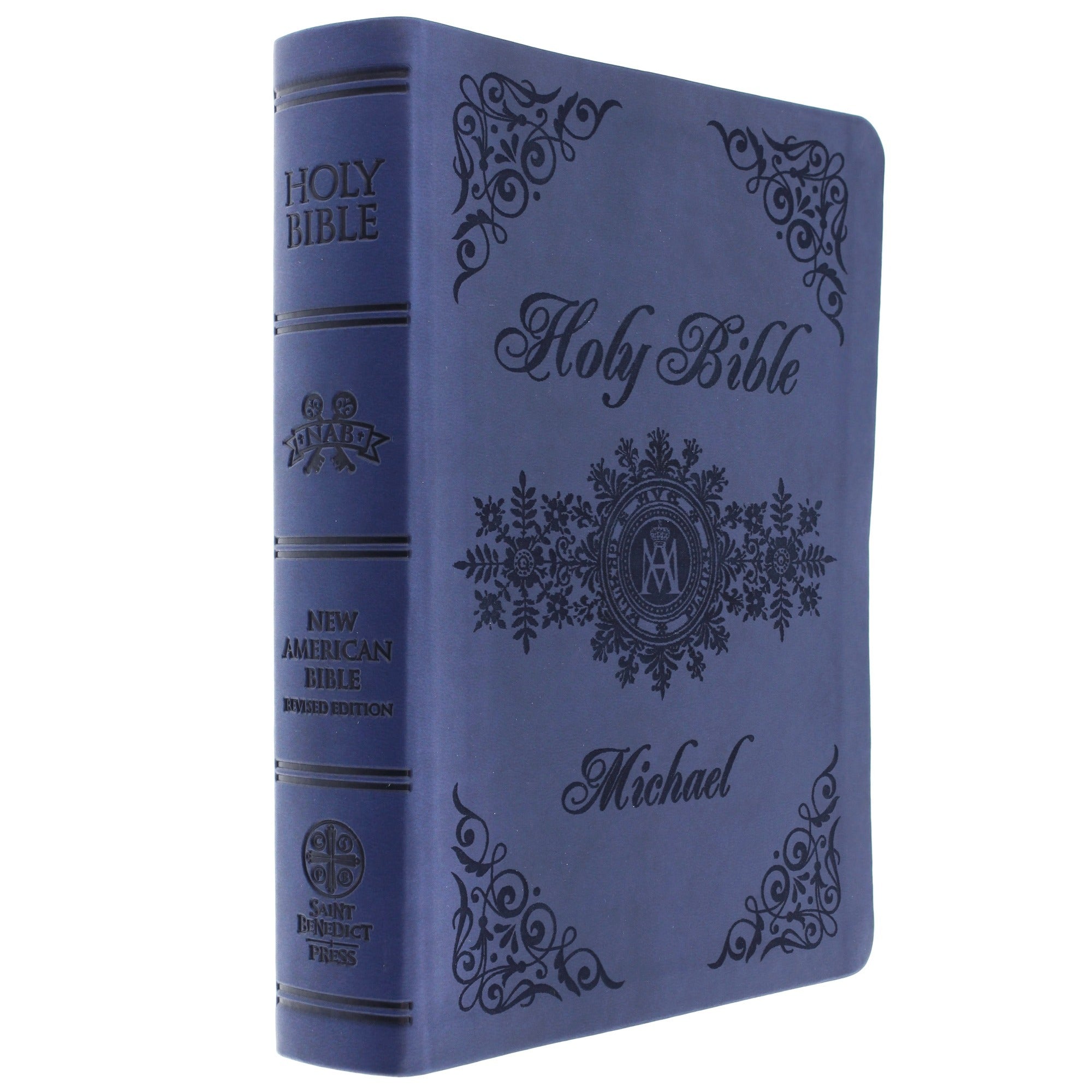 Blue, padded Holy Bible, New American Bible Revised Edition, with dark decorative details.