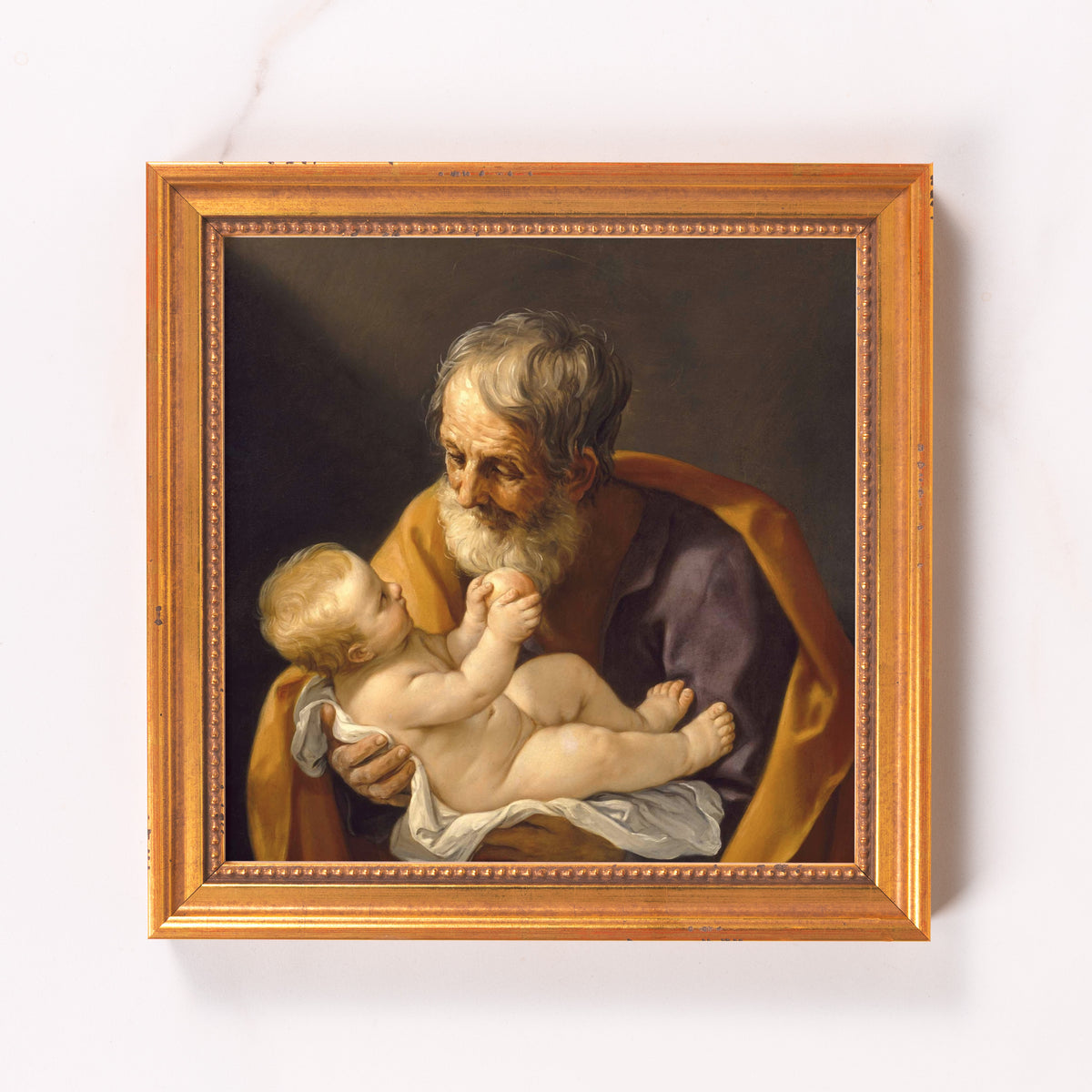 Framed painting shows an elder holding a baby, rendered in classic style with gold frame.