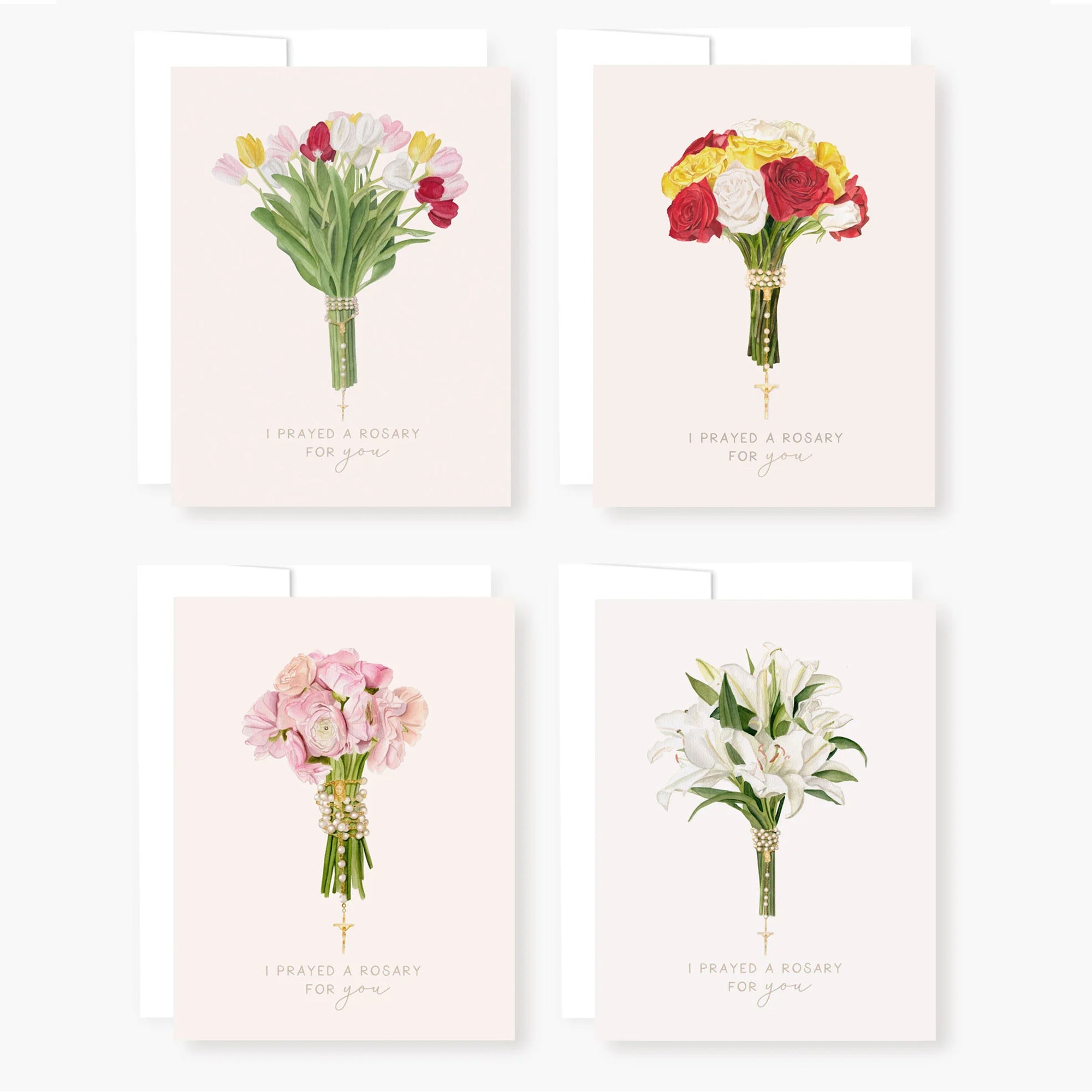 Assortment of "I prayed a rosary for you" greeting cards with floral bouquets and a rosary wrapped around the stems.