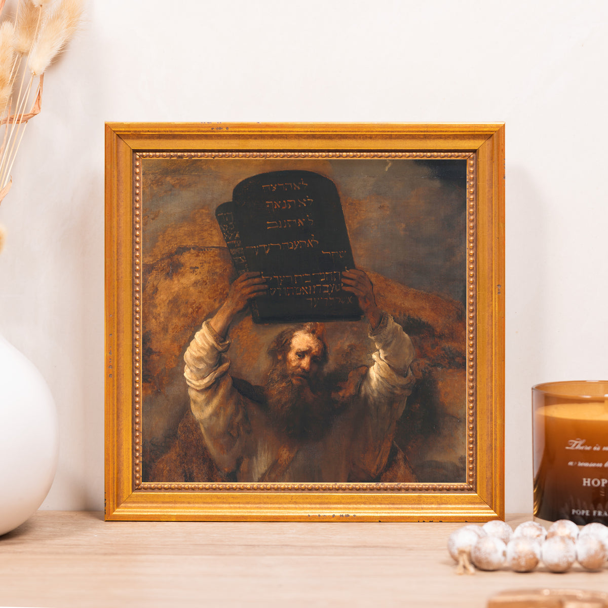 Moses Holding the Ten Commandments art print with gold frame shows an oil painting reproduction with Hebrew text.