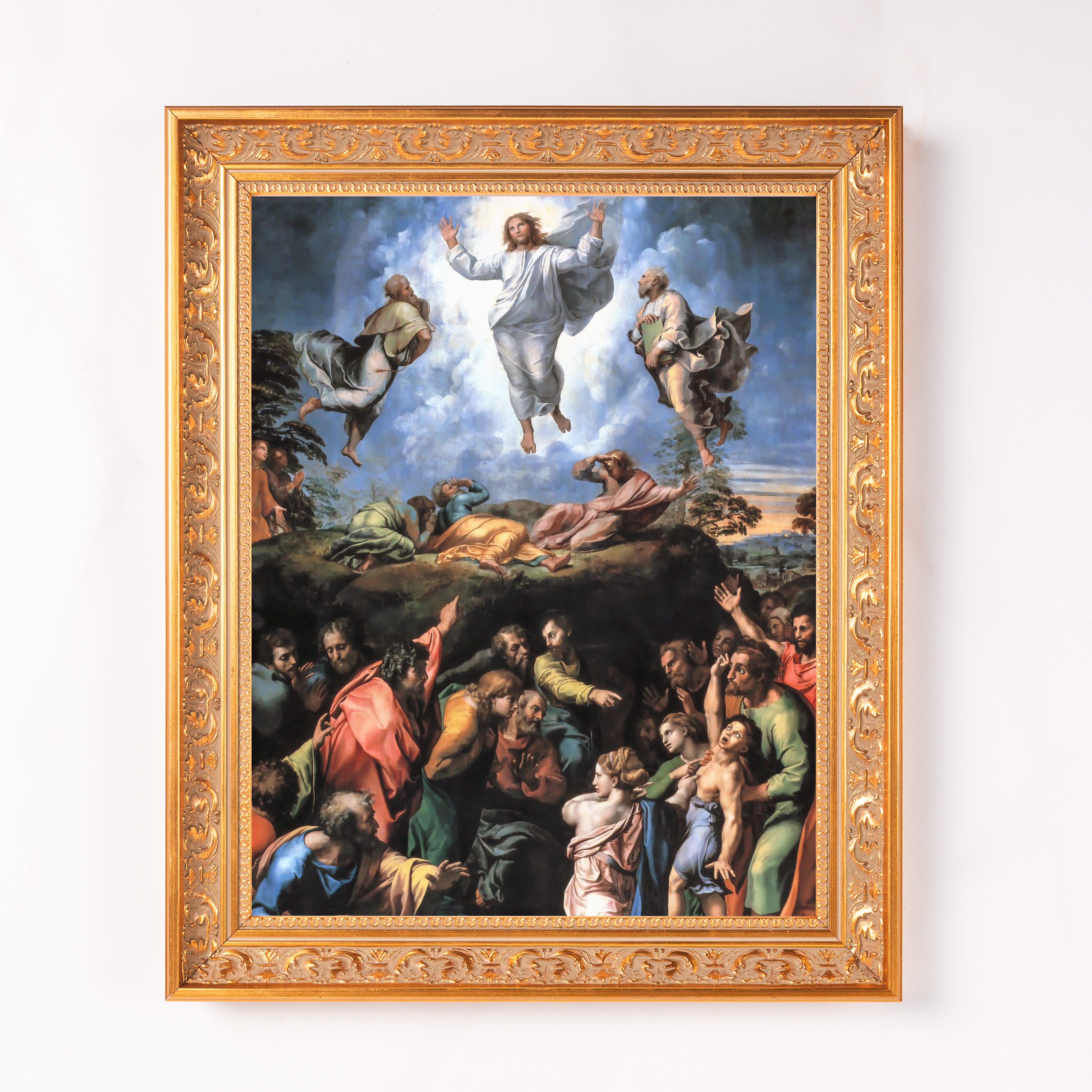 Framed painting, The Transfiguration, with gold ornate frame, of Jesus surrounded by figures on blue sky background.