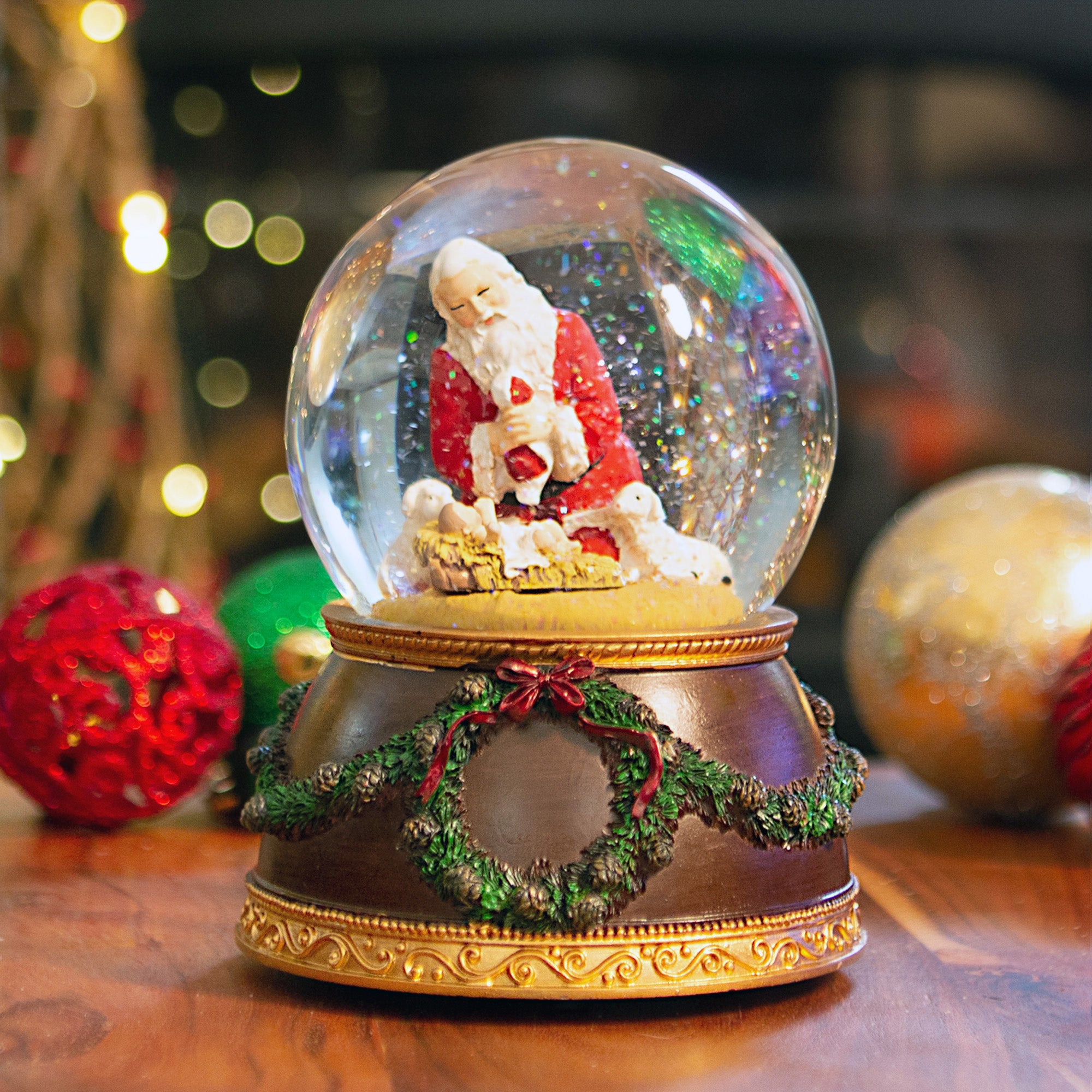 Kneeling Santa Musical Snowglobe