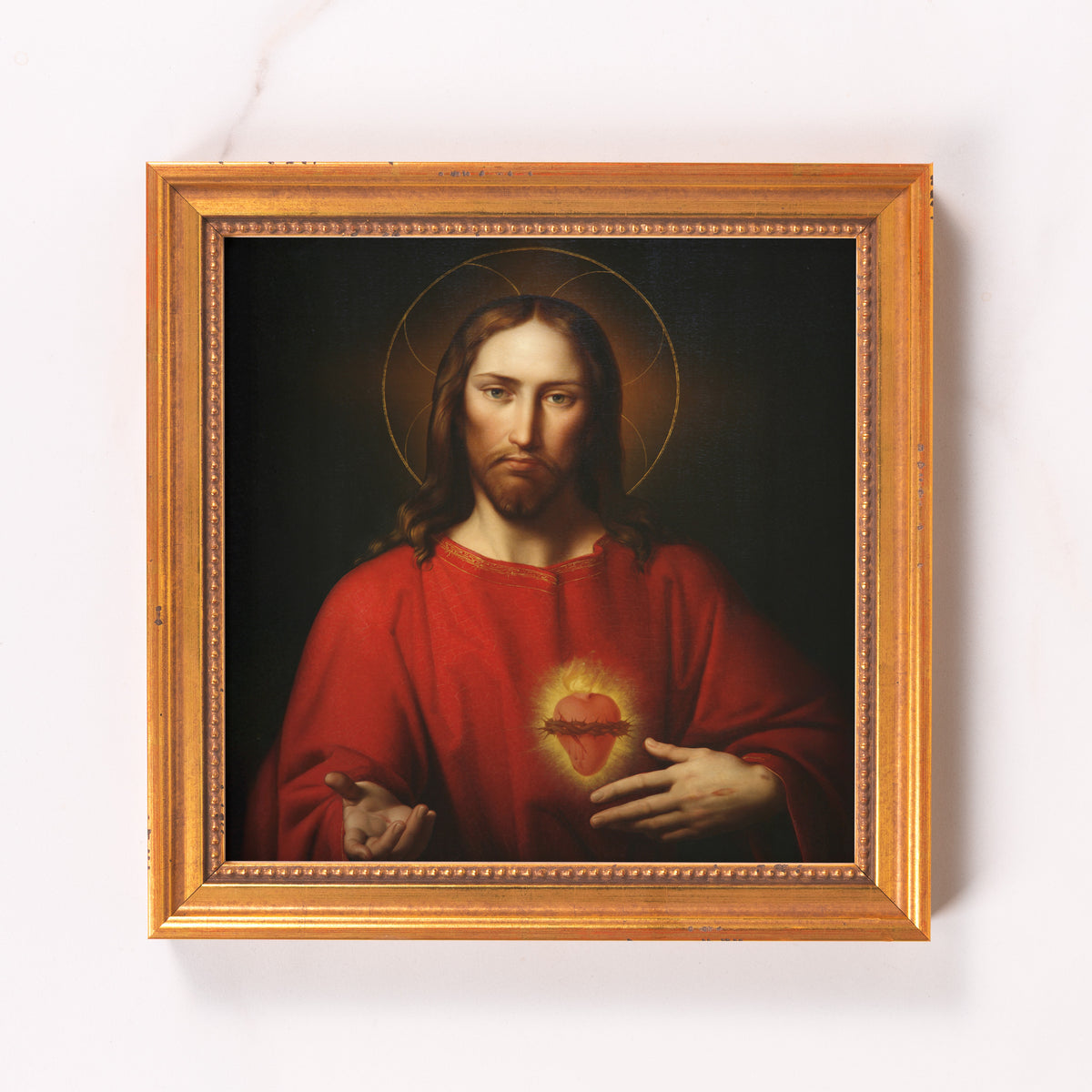 Framed painting depicts Jesus Christ in a red robe with a gold halo.