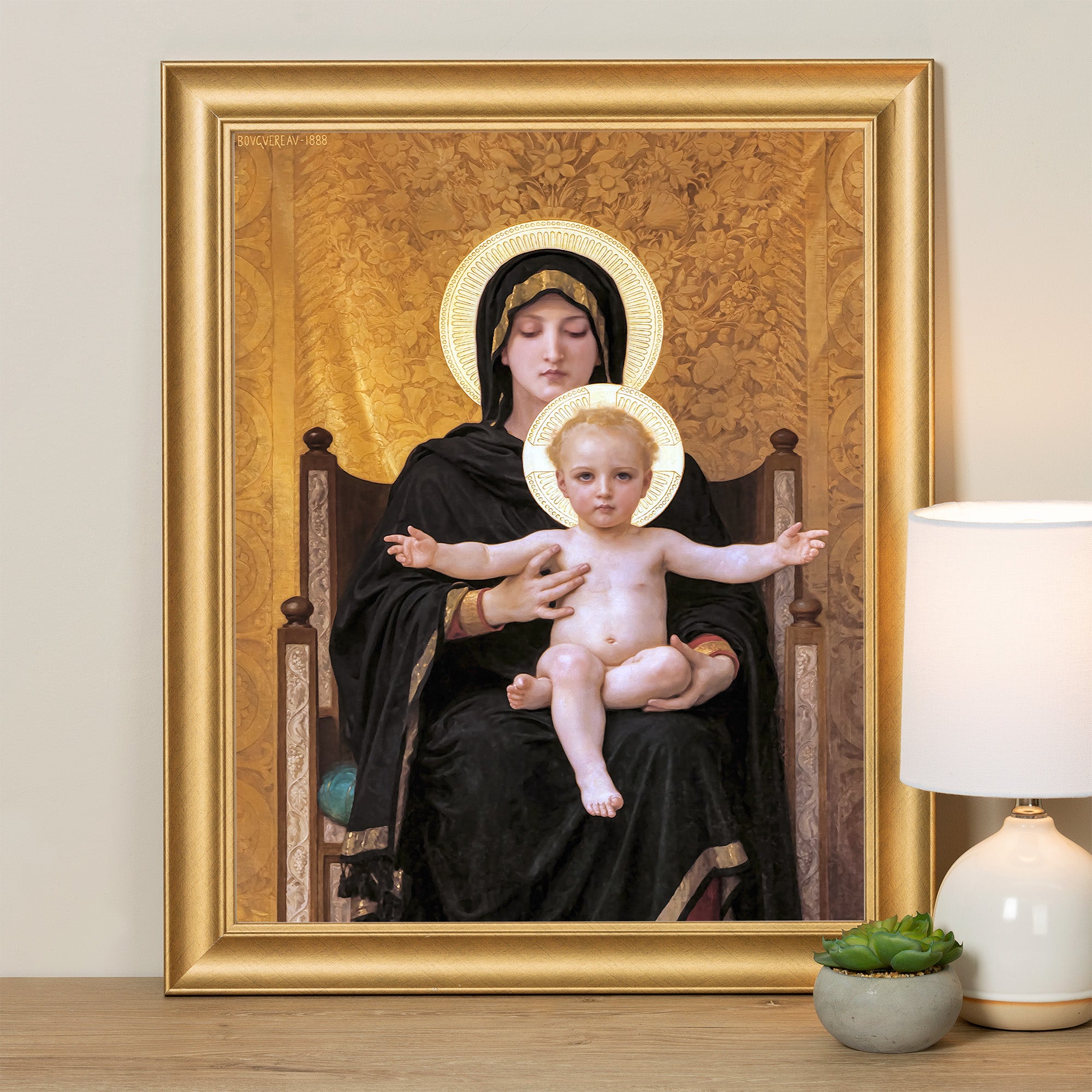 Framed painting of Madonna and Child with halos, in black robe and gold background.