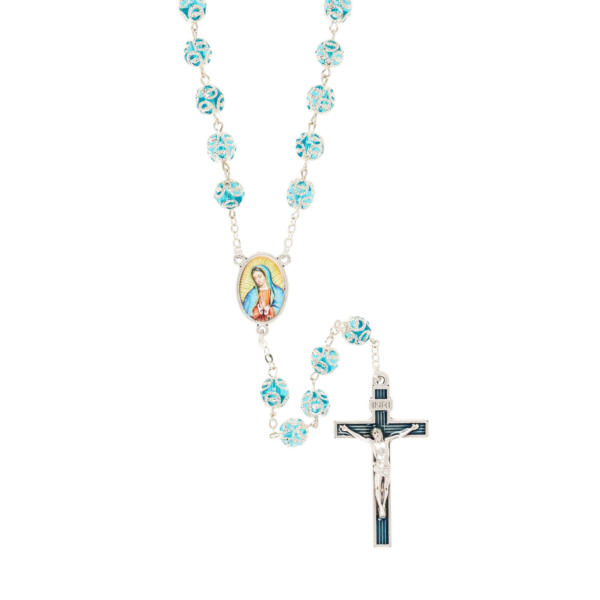 Silver rosary with blue patterned beads, Virgin Mary centerpiece, and crucifix, for prayer and religious devotion.