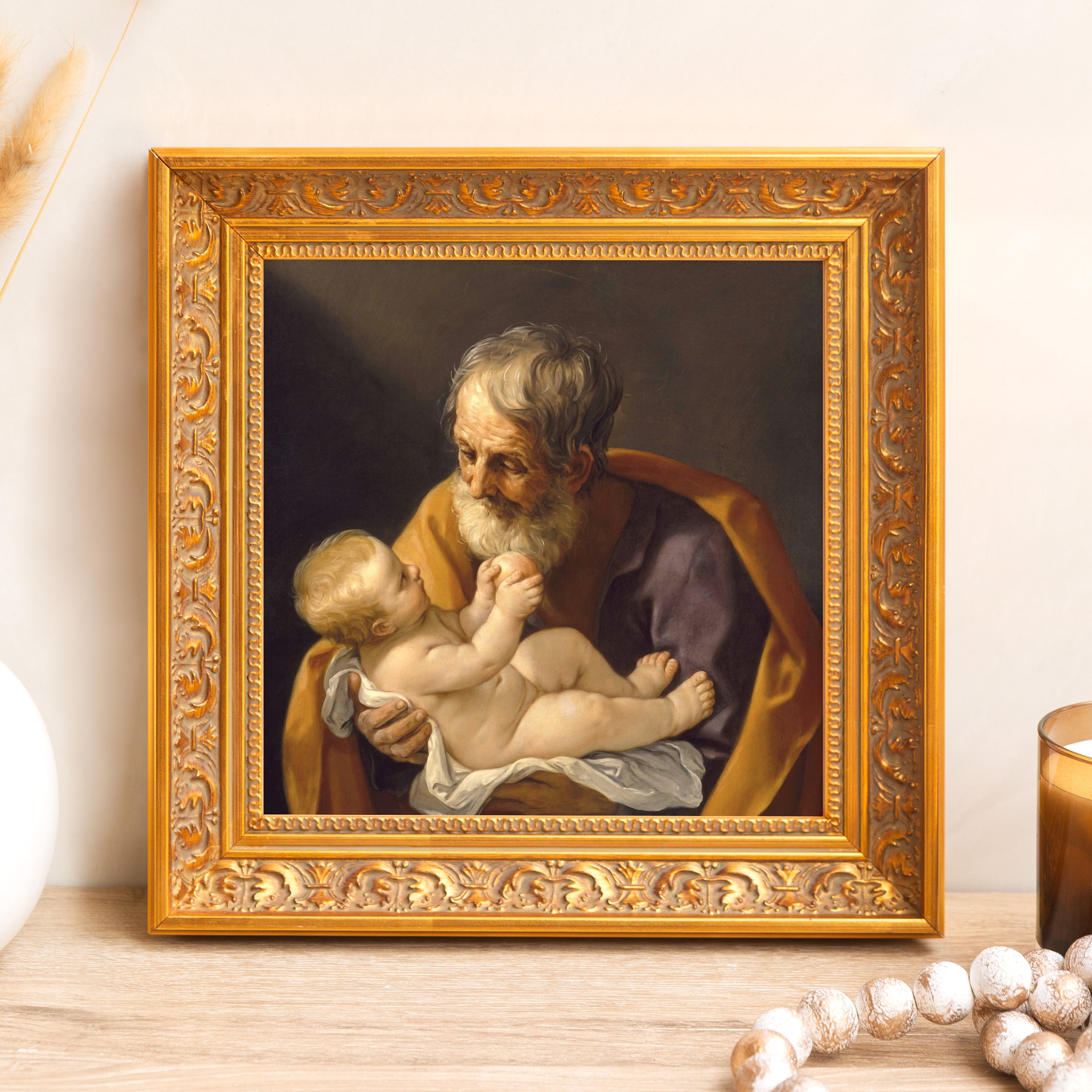 Framed print shows a vintage-style man holding a baby in gold ornate frame.