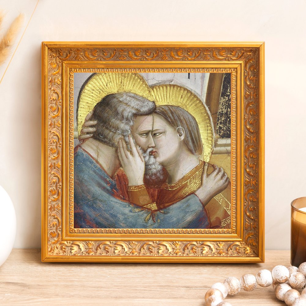 Framed art print of a loving embrace with golden halos in an ornate gold frame.