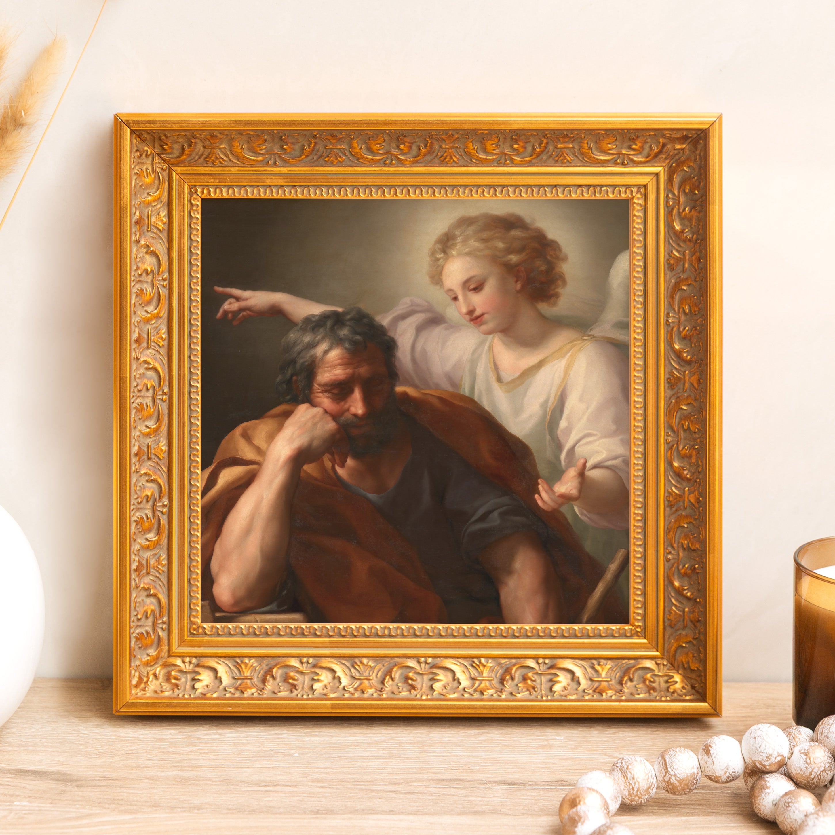 Framed religious art print depicting Joseph and angel, in gold ornate frame.