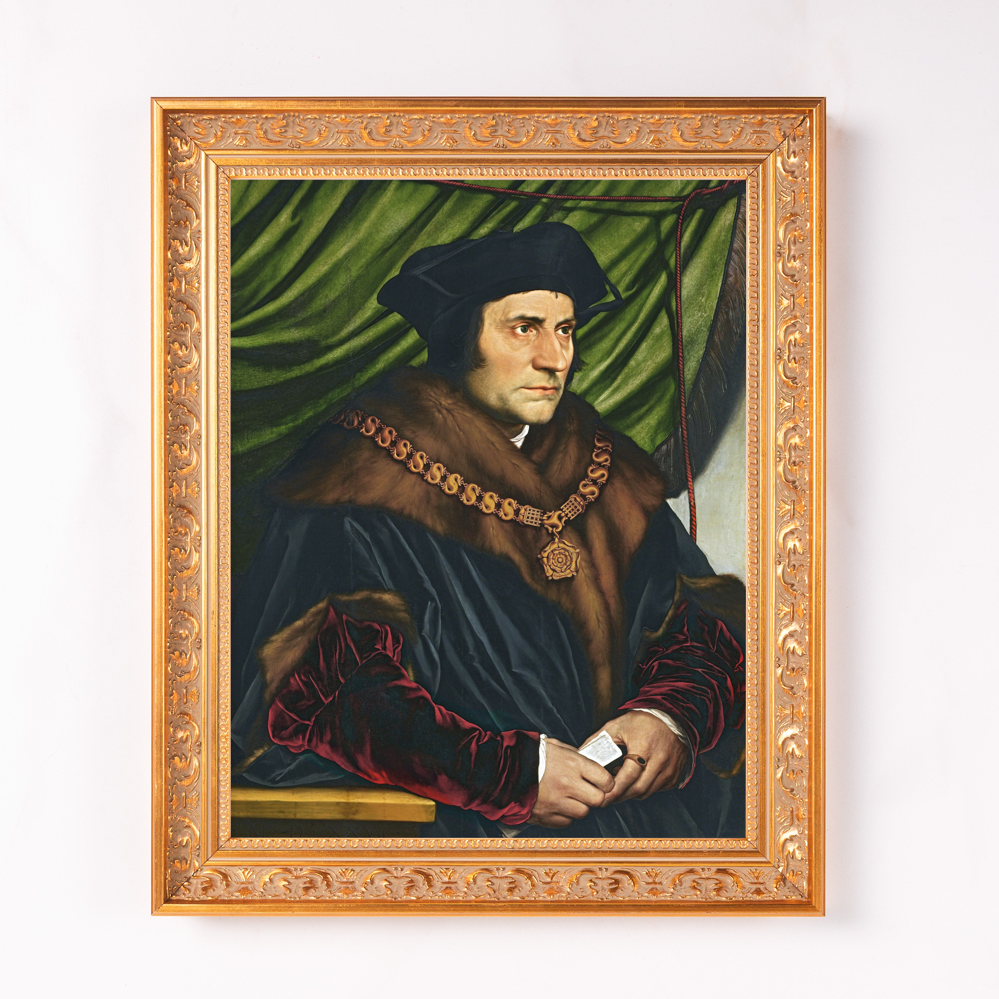 Framed portrait painting of a man in a black robe with fur, wearing a gold chain necklace.