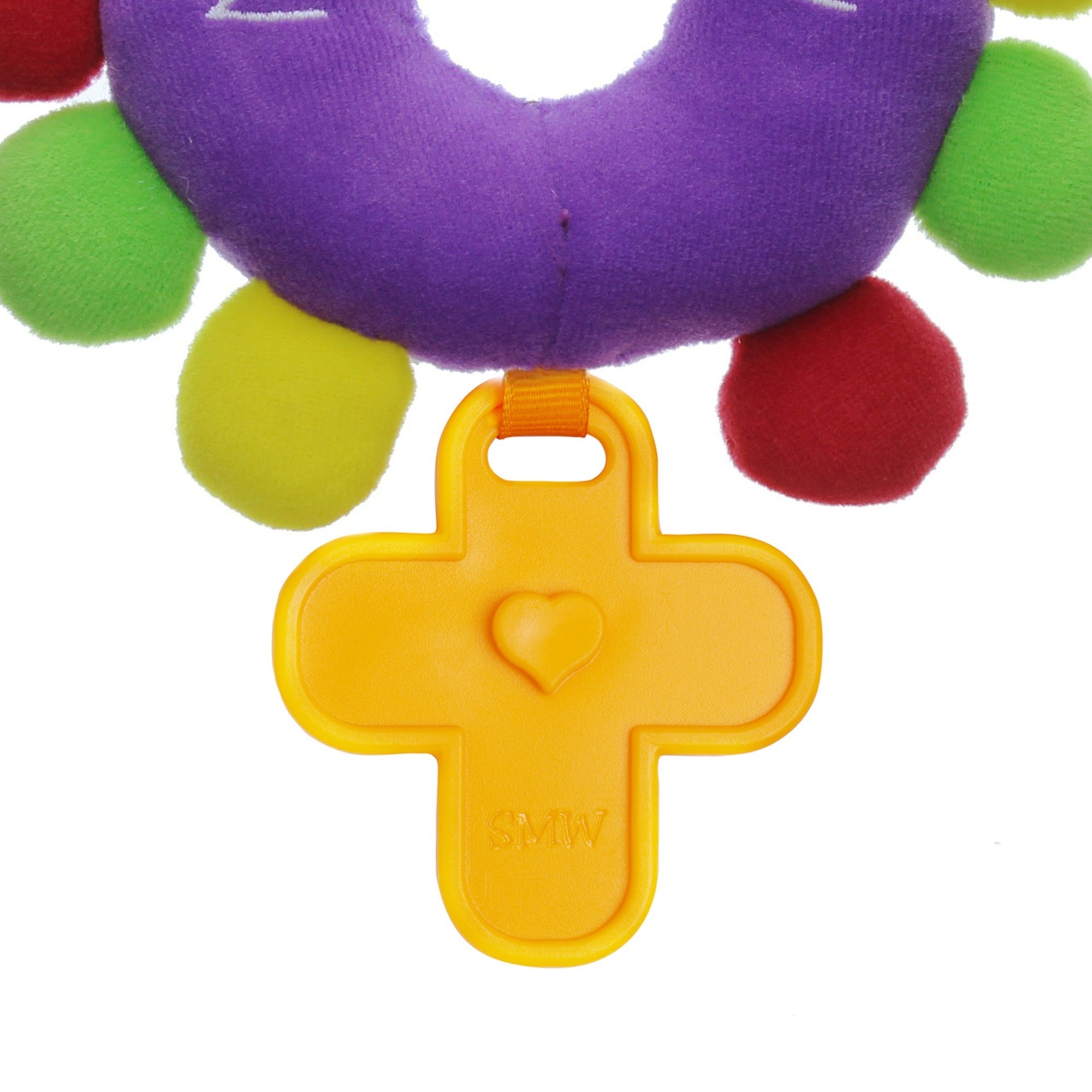 Infant teether with purple plush top and yellow plastic cross shaped piece.