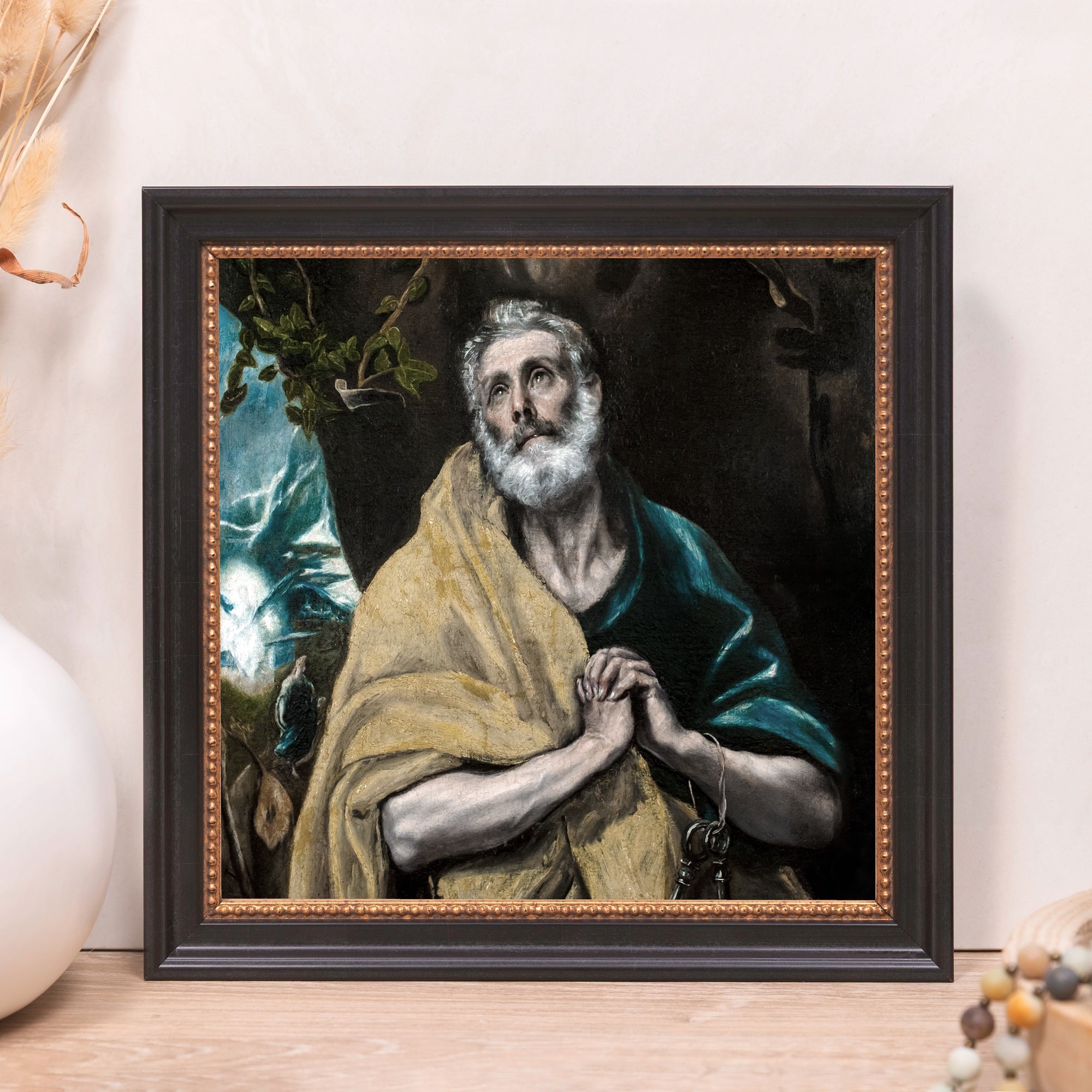 Framed Canvas print of Saint Peter in tears, wrapped in a yellow cloth, with a dark brown frame.