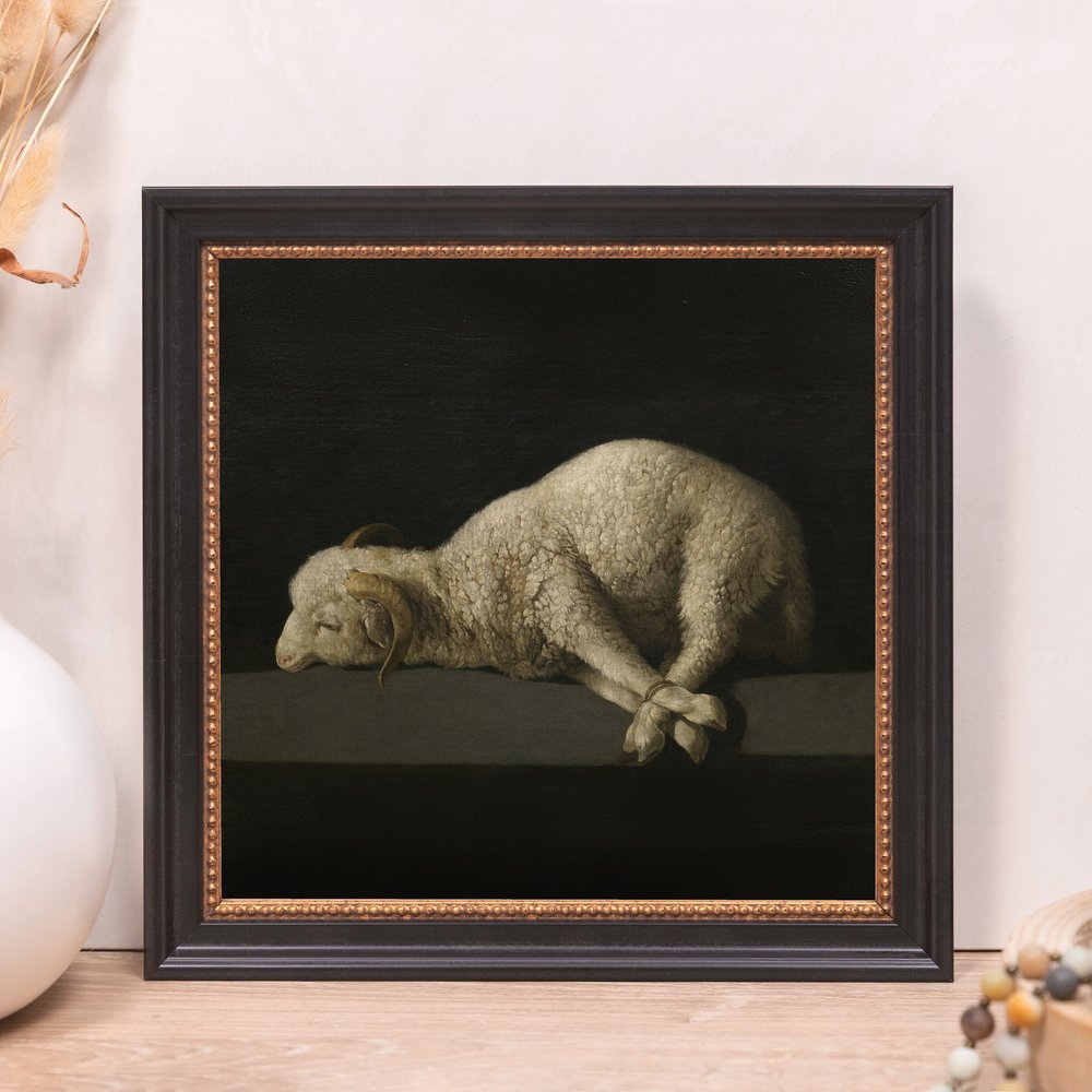 Framed painting of a resting white ram with bound legs in a dark, moody style.