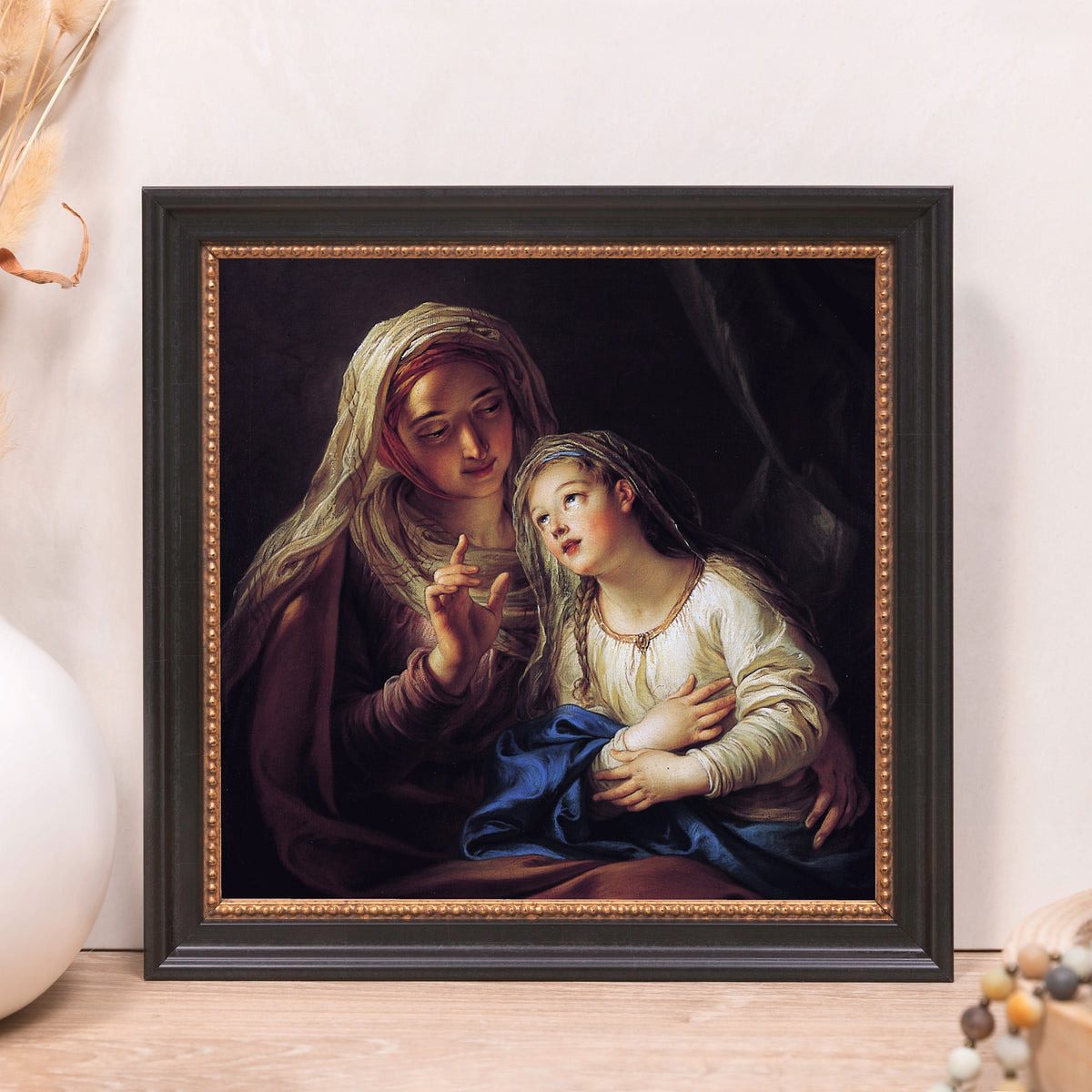 Framed art print featuring a classic religious scene with a black and gold frame.