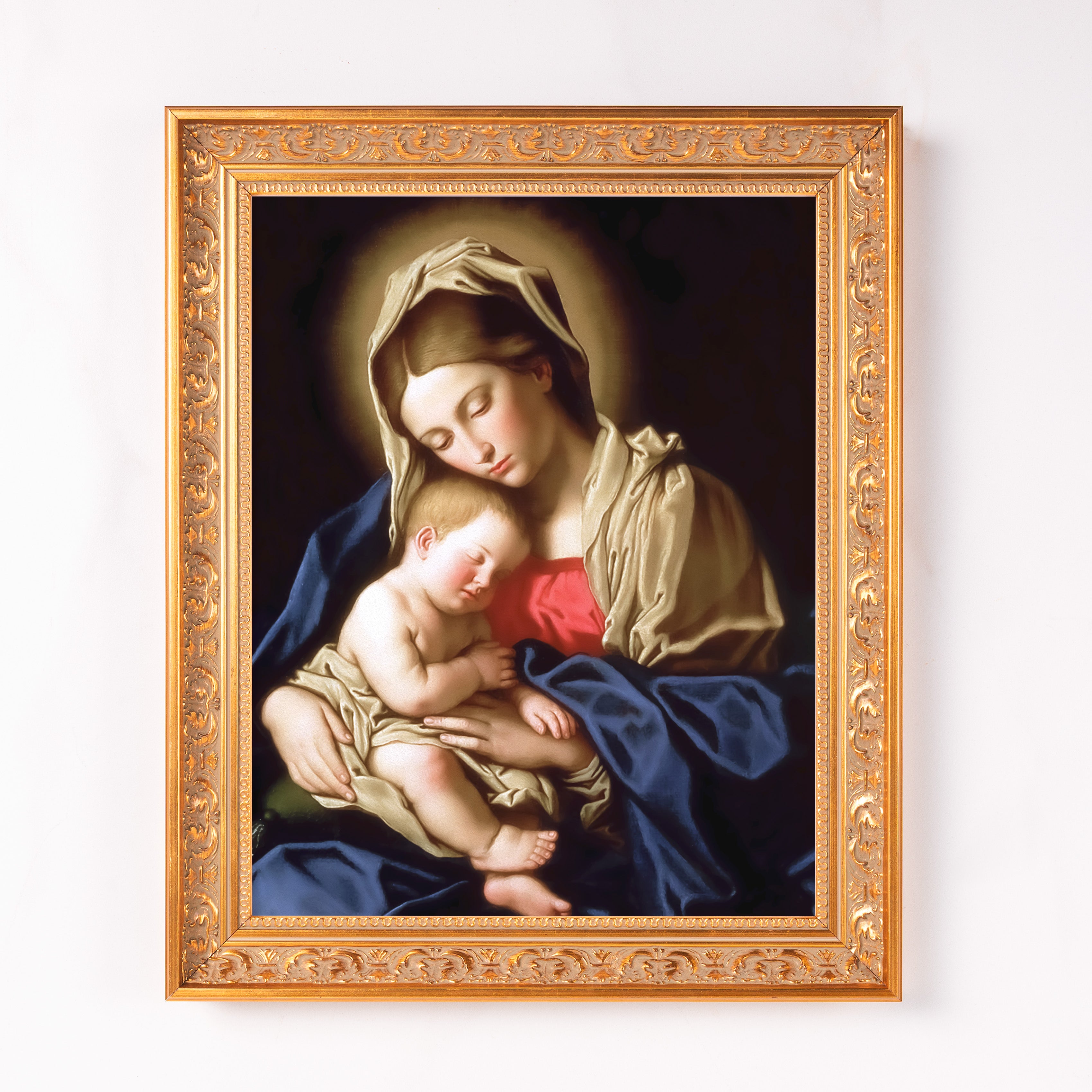 Framed, Madonna and Child print with ornate, gold-tone frame.
