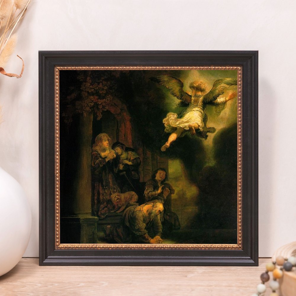 Framed fine art print depicting a Rembrandt-style oil painting of an angel visiting kneeling figures in dark colors and light highlights.