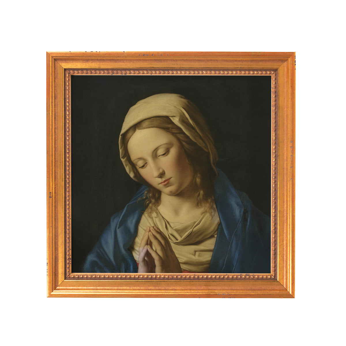 Framed painting of praying Mary in blue robe and cream-colored head covering.