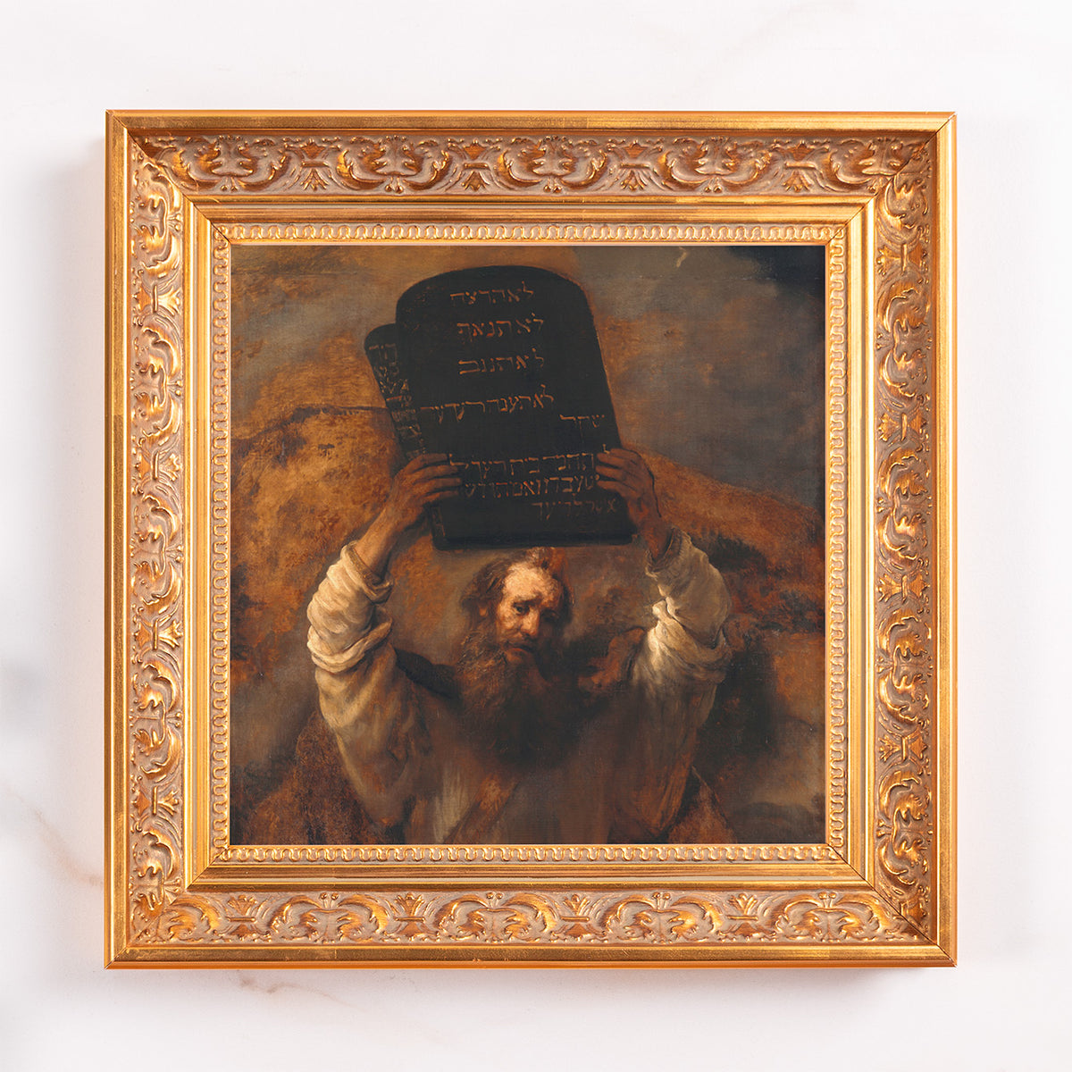 Framed canvas art print of Moses with stone tablets in a golden ornate frame for wall décor.