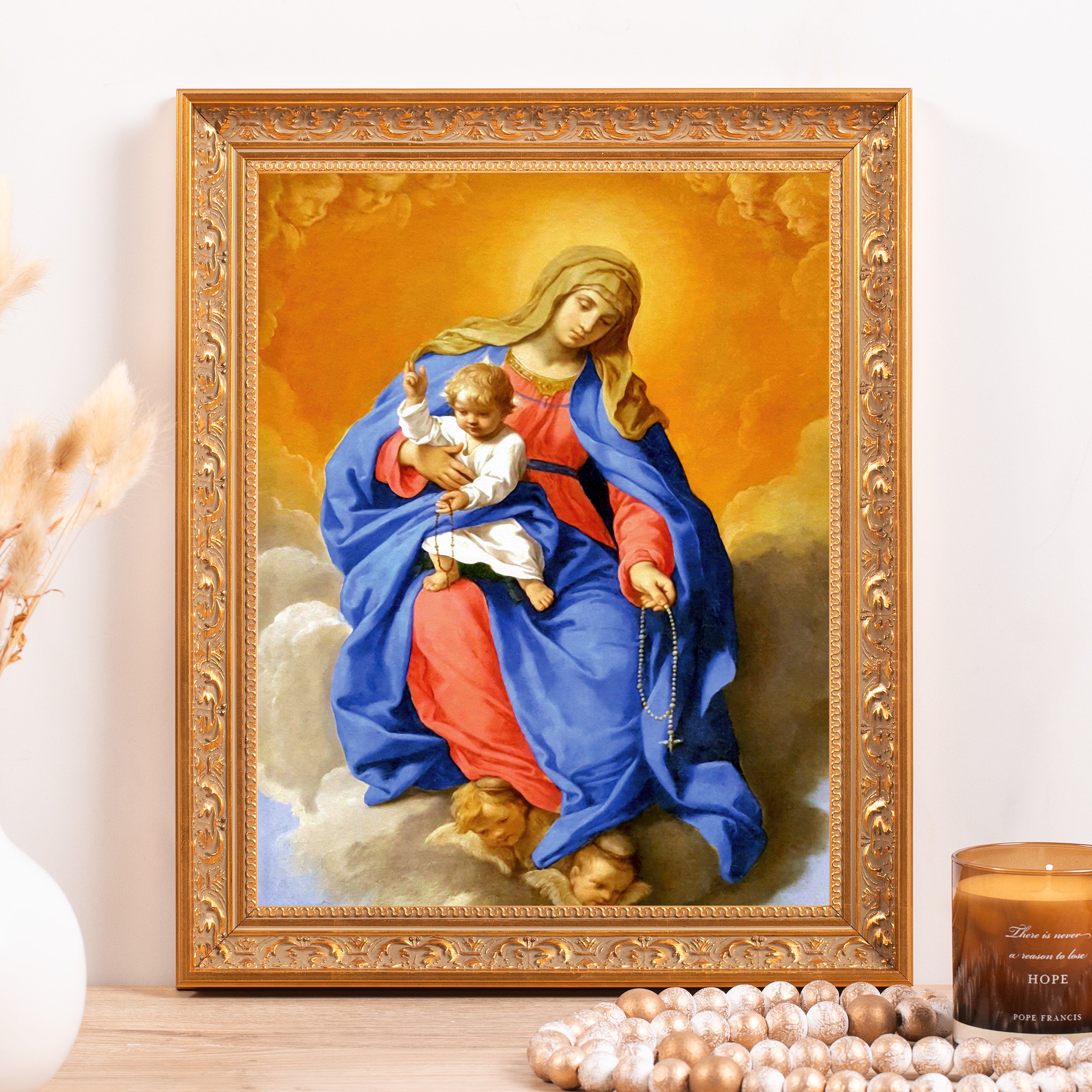 Framed Our Lady of Grace print depicts Madonna and Child with a rosary, in a gold frame.