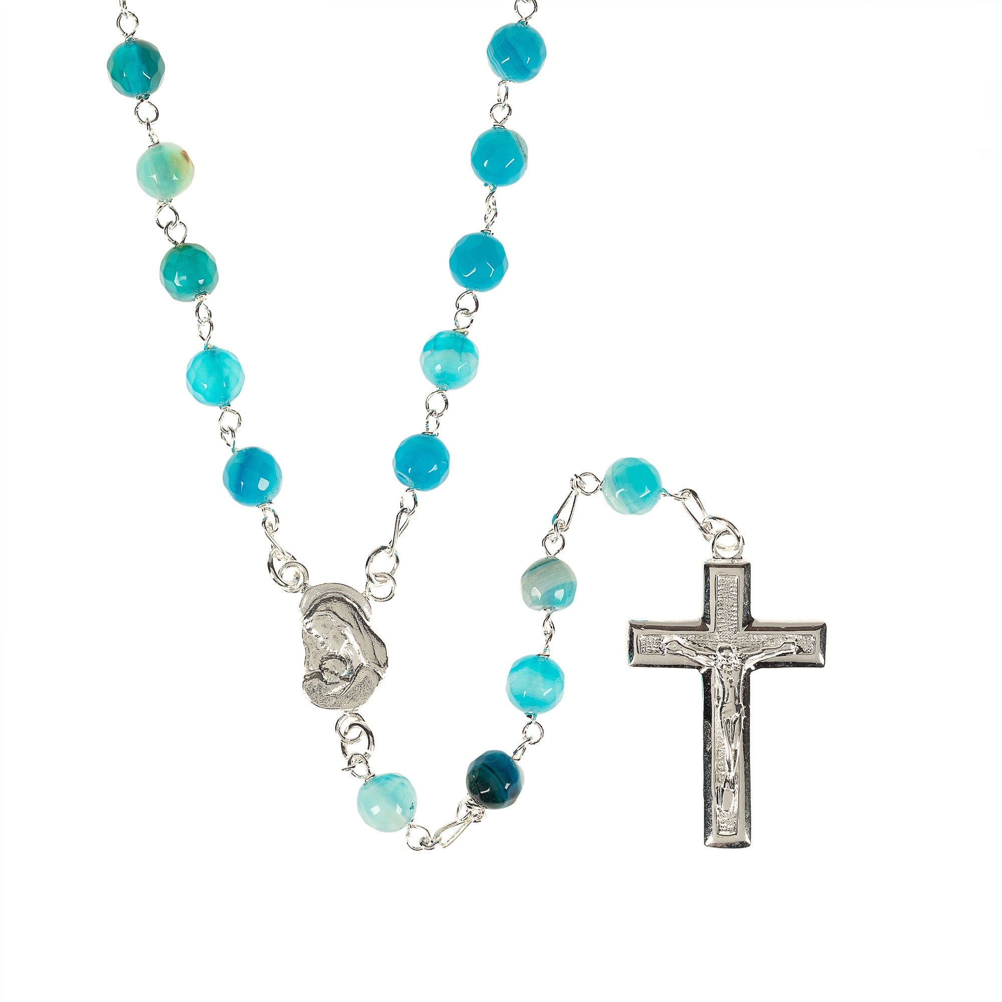 Turquoise rosary with metal crucifix and center piece on a white background.