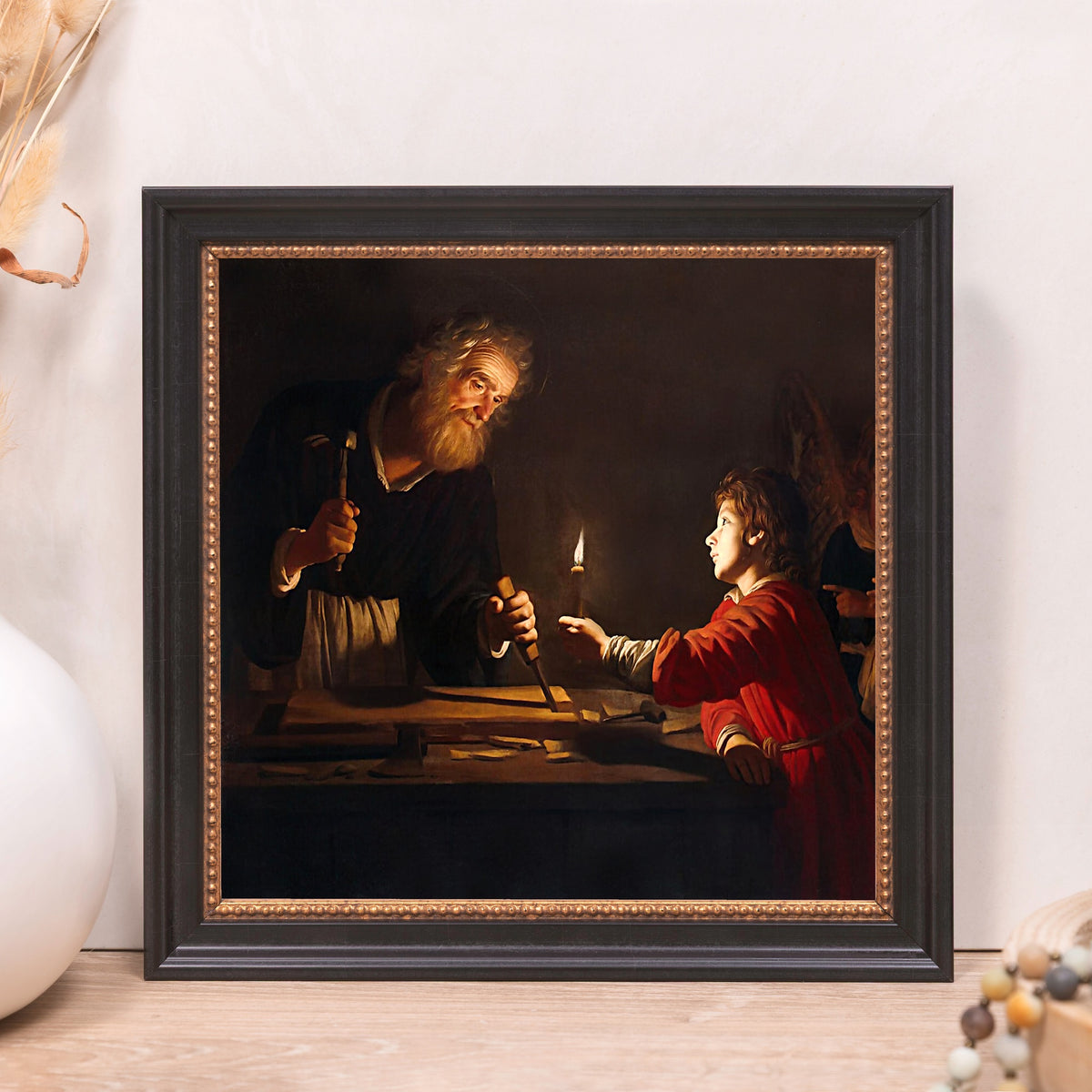 Framed painting of Joseph and Jesus, oil on canvas with dark ornate frame.