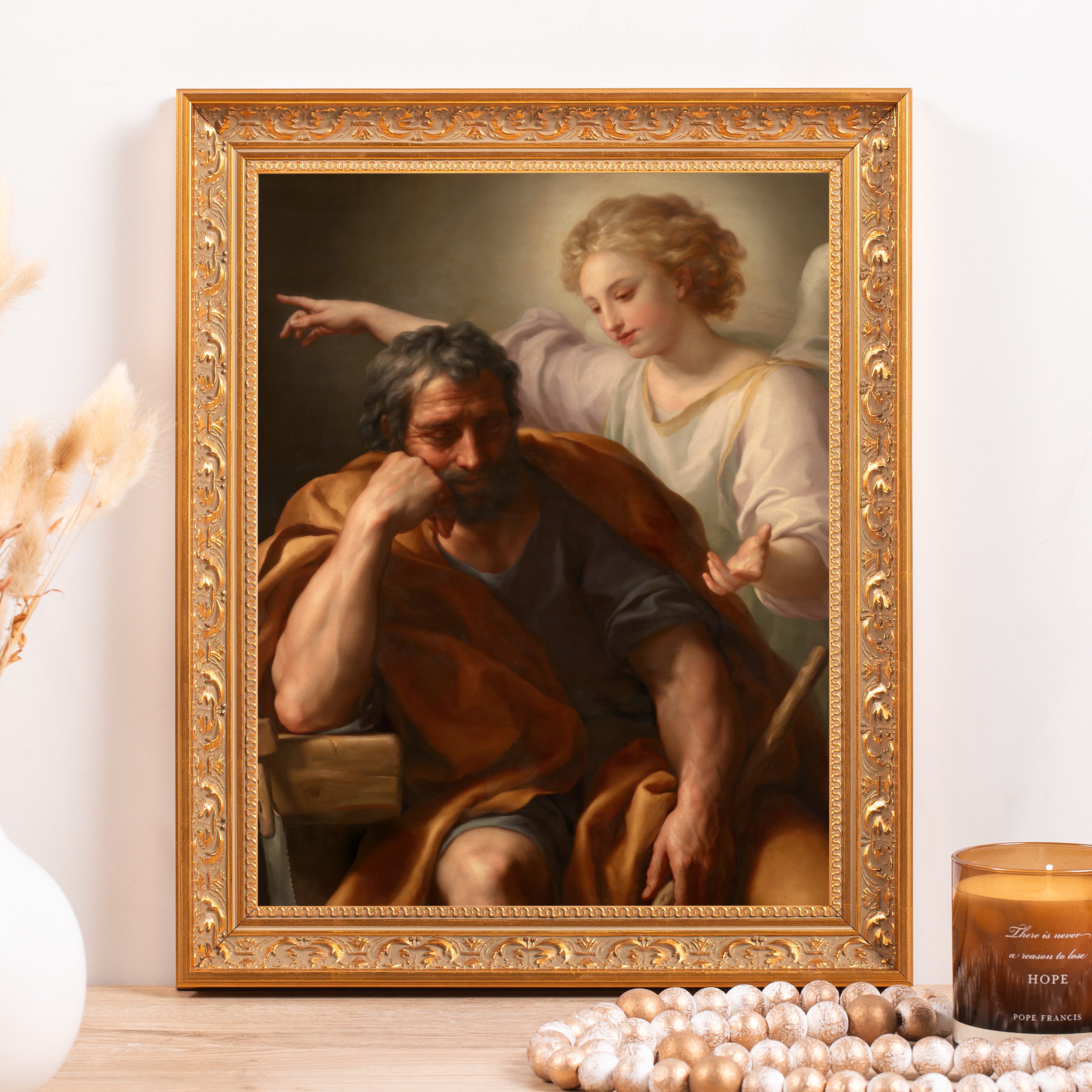 Framed oil painting print depicting Joseph and an angel in an ornate gold frame.