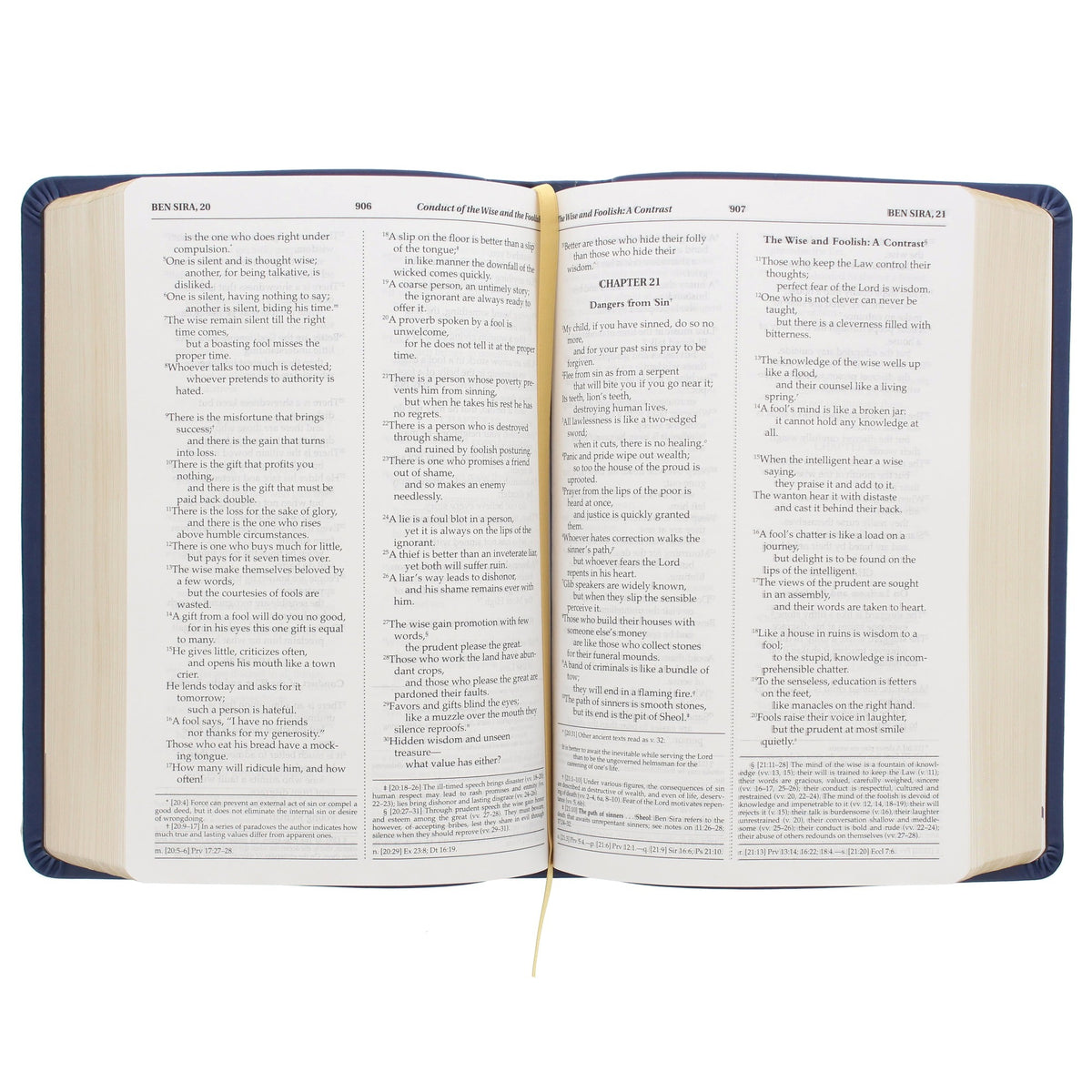 Open Hardcover book displaying biblical passages in a serif font on off-white pages with a navy blue spine.