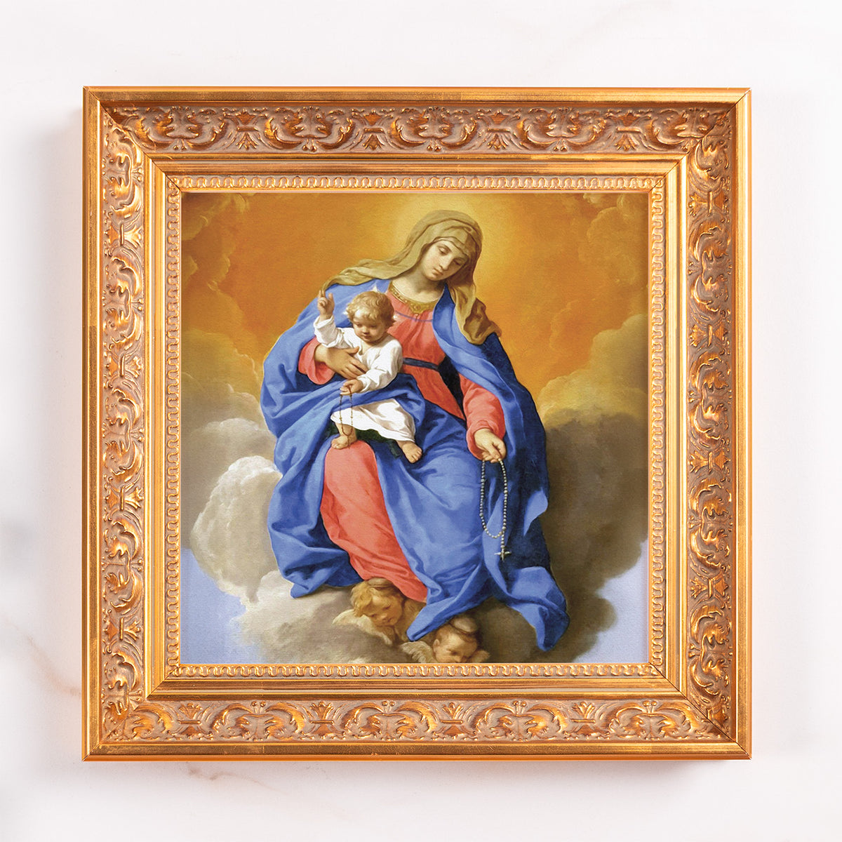 Framed Mary and Child print. Gold ornate frame surrounds painting of Madonna with baby Jesus on clouds.