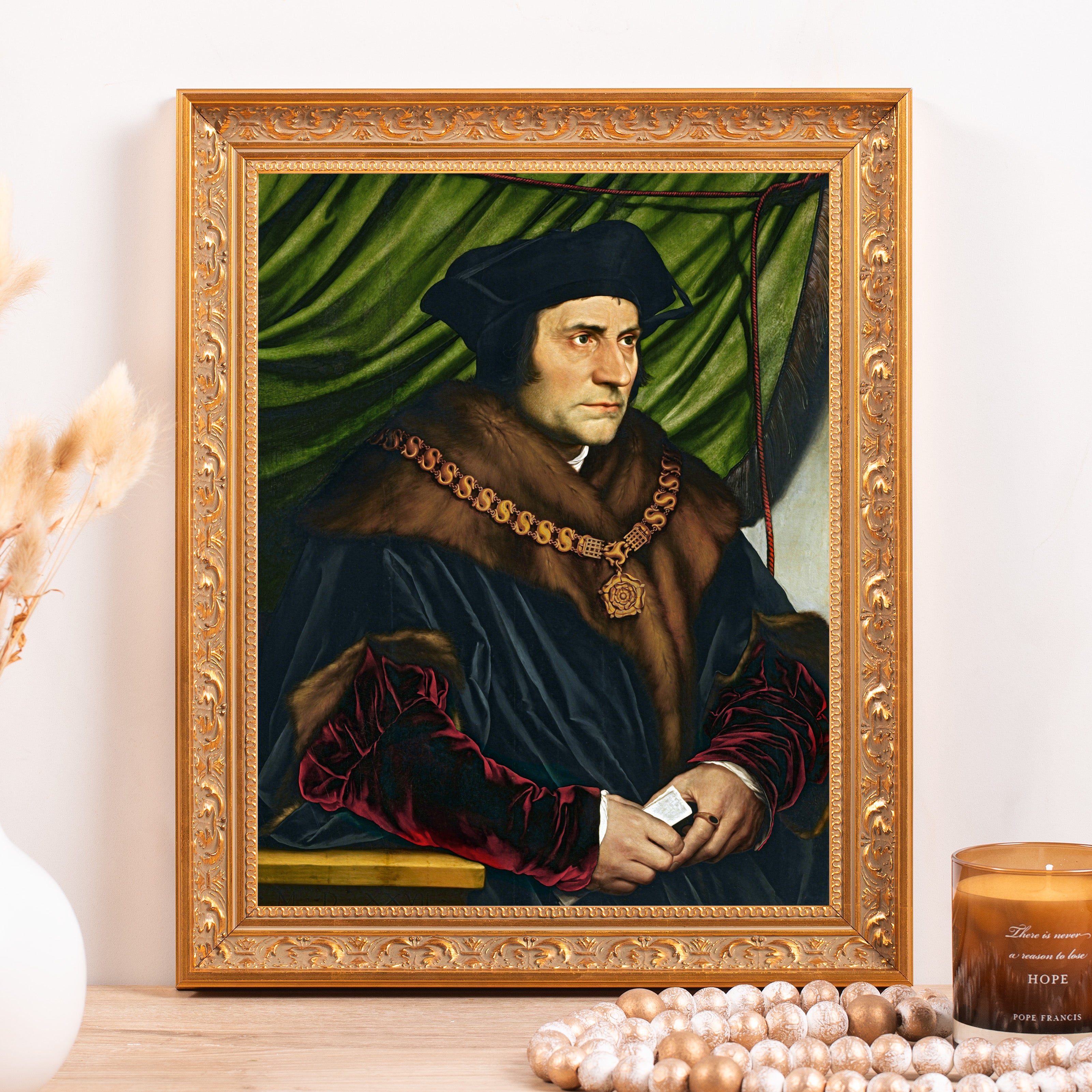 Framed, Man's portrait in historical clothing, brown fur collar, and gold chain against green background.
