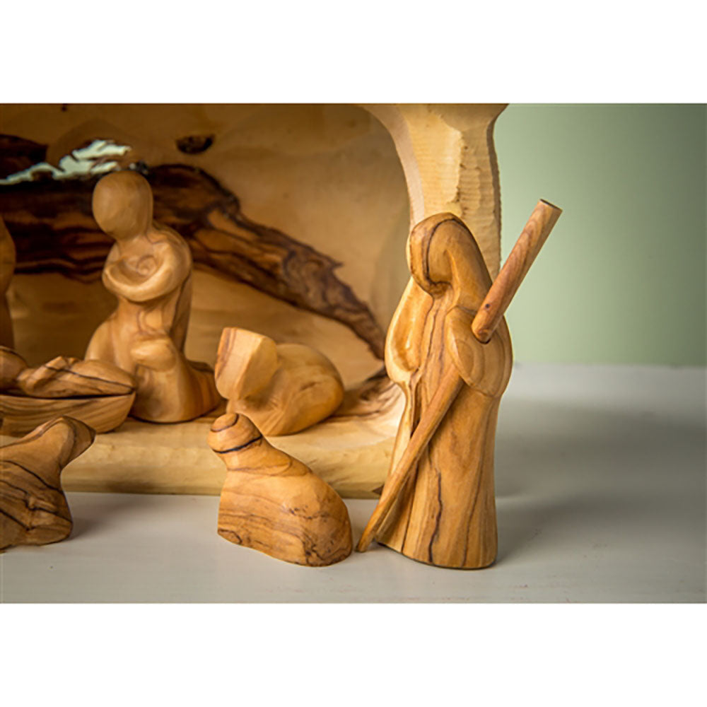 Olivewood nativity scene with carved figurines, light brown and simple design.