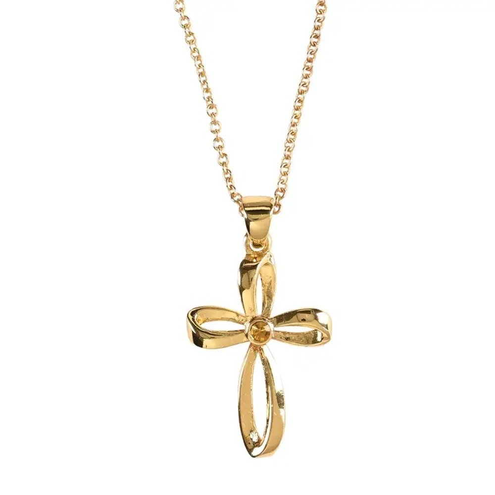 Gold-toned necklace with cross pendant featuring a yellow gem in the center and ribbon design.