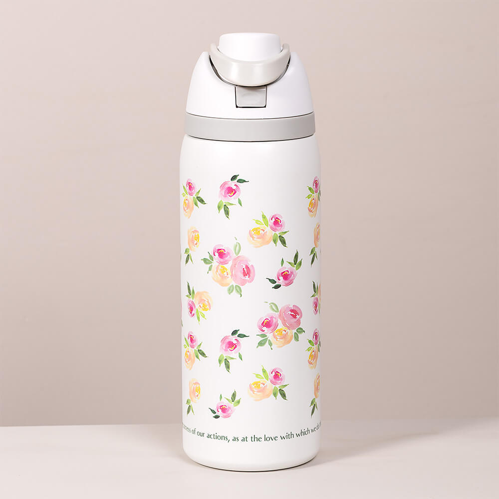 White, stainless steel water bottle with pink and yellow floral pattern and gray lid.