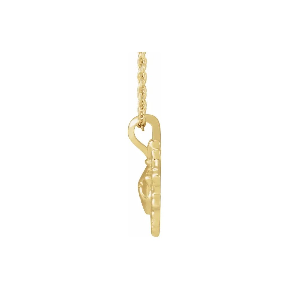 Gold Claddagh pendant necklace with a Celtic design.