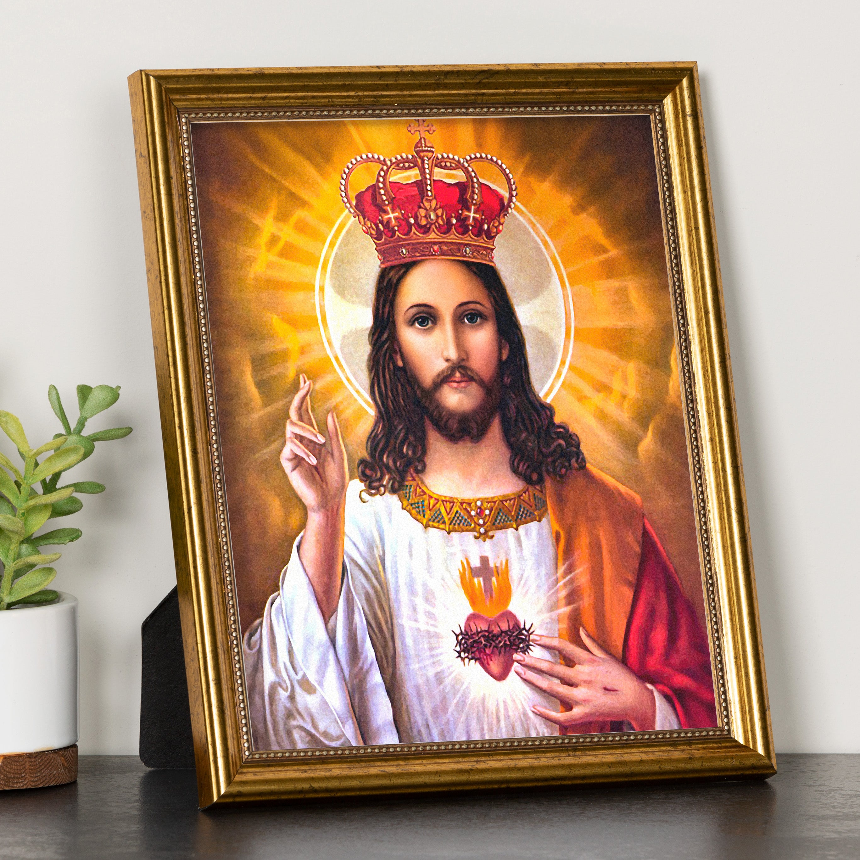 Religious framed art, depicts Jesus in white robe with golden frame.