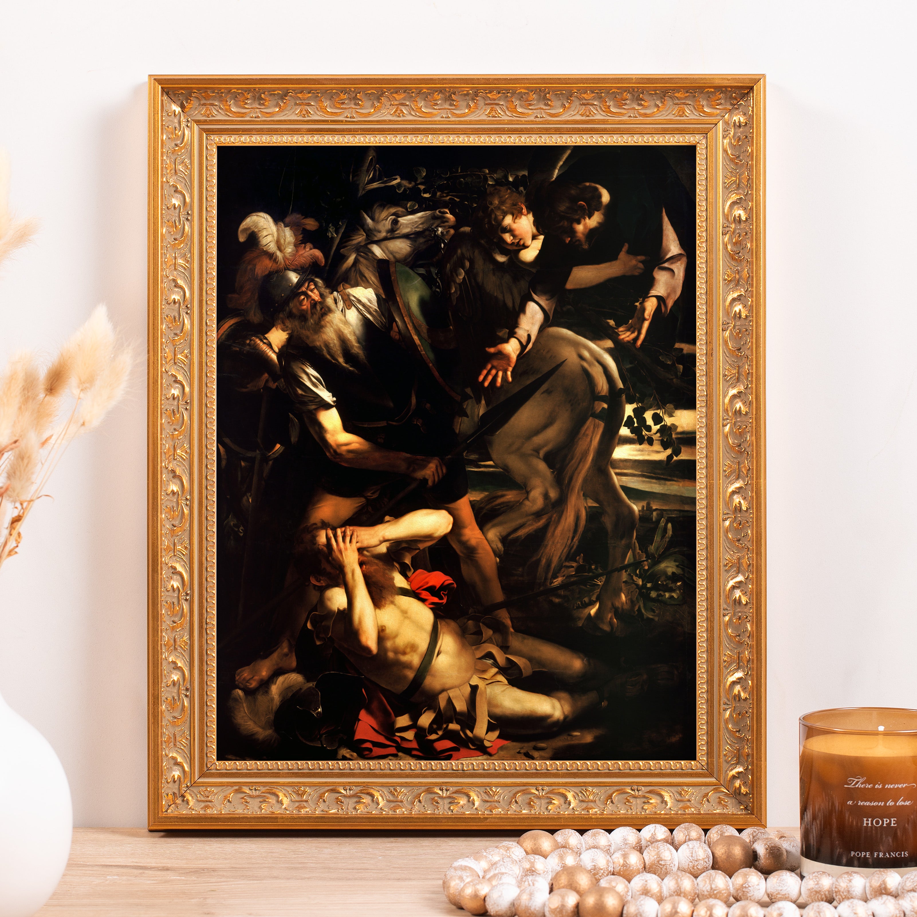 Framed Caravaggio artwork depicting the Conversion of Saint Paul in gold ornate frame for wall decor or display.