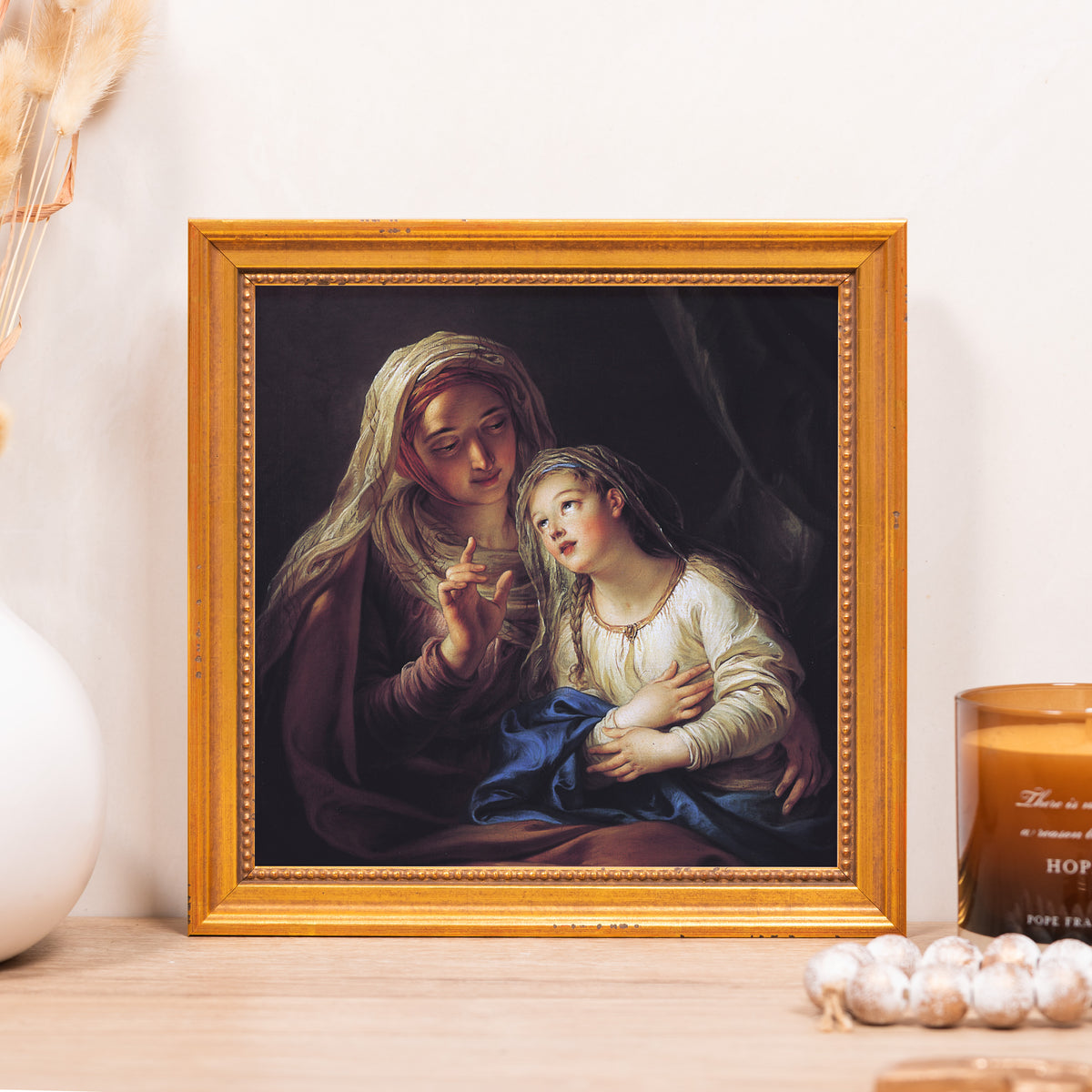 Framed painting depicts a mother and daughter with a gold frame, in a classical style.