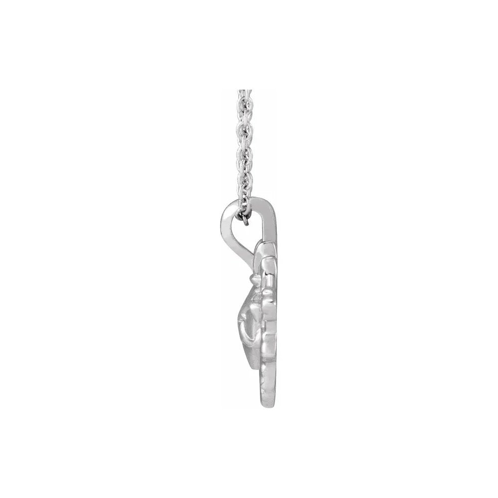 Silver-toned necklace with a delicate chain and snowflake pendant.
