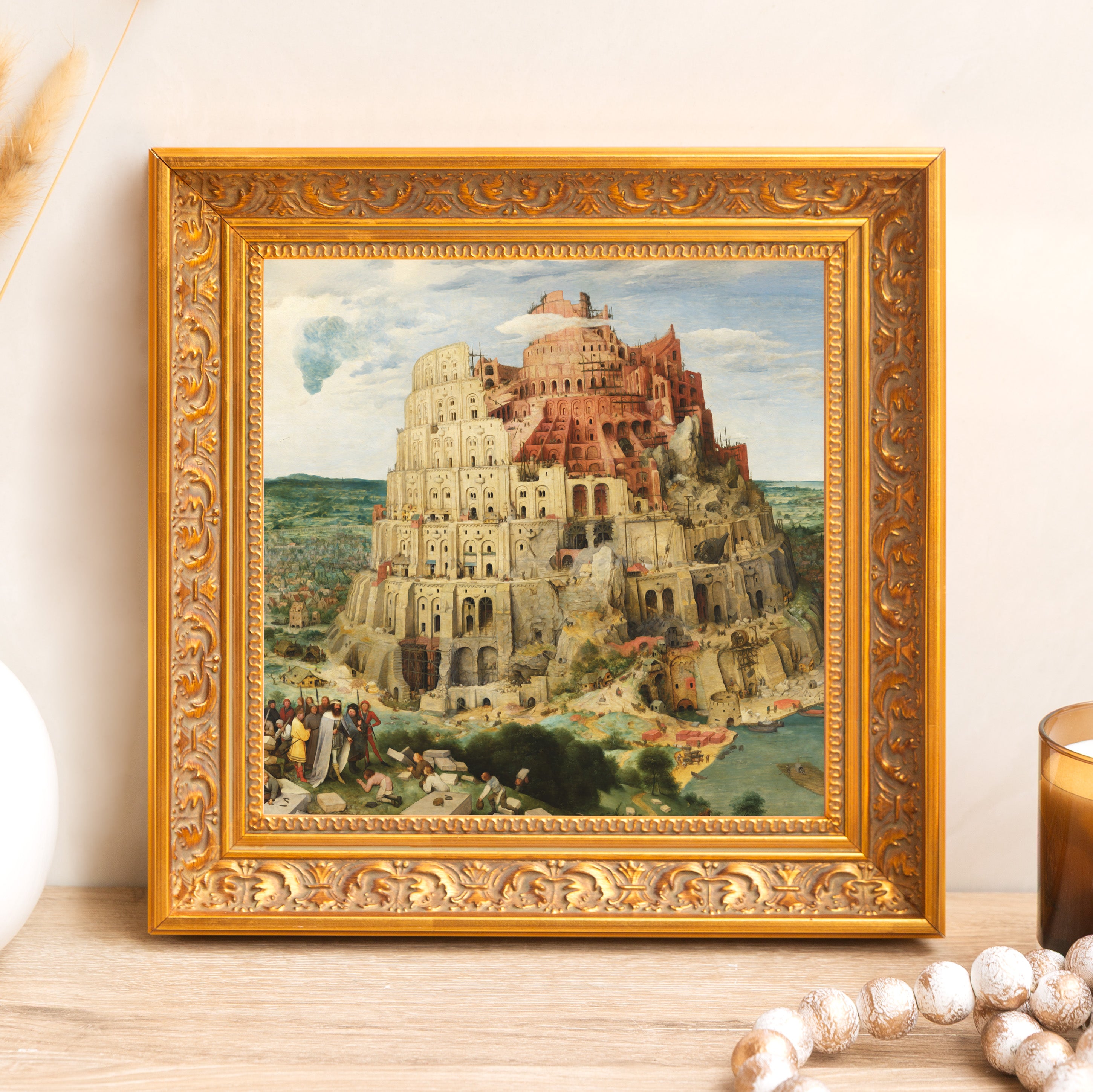 Framed "Tower of Babel" print. Gold ornate frame surrounds a landscape painting.